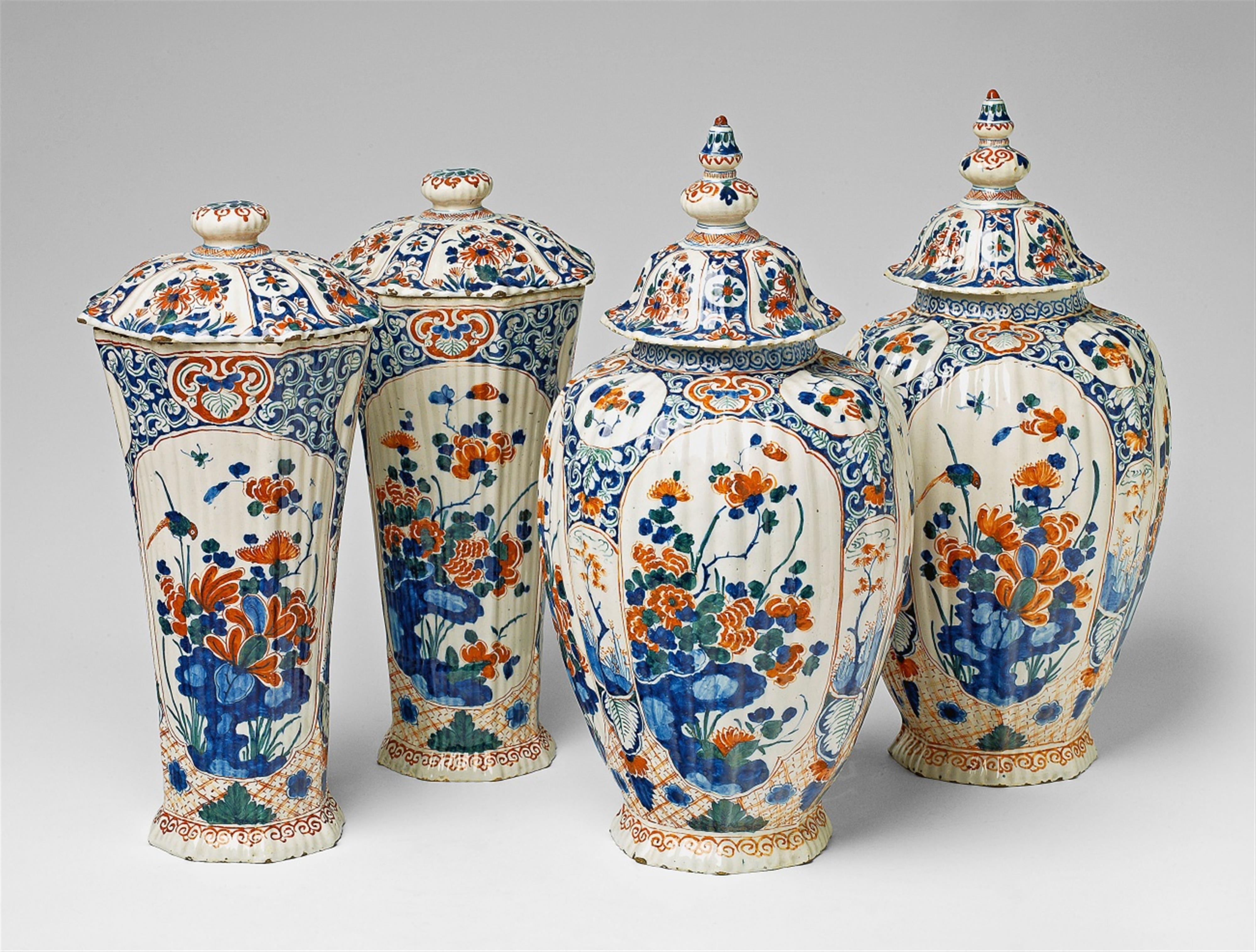 A rare set of four Delftware vases and covers - image-1