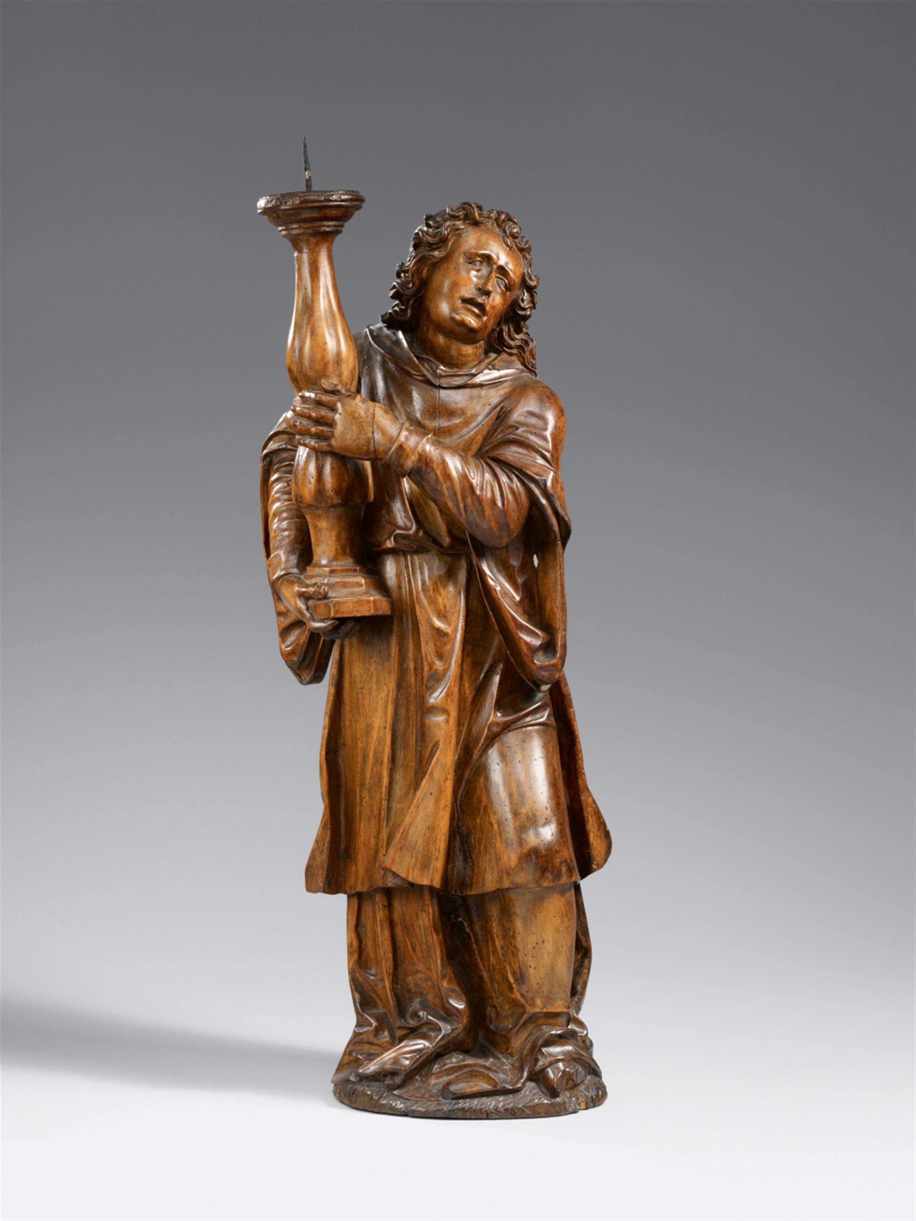 Flemish, late 17th century - A late 17th century Flemish carved wooden Angel with a candle holder - image-1