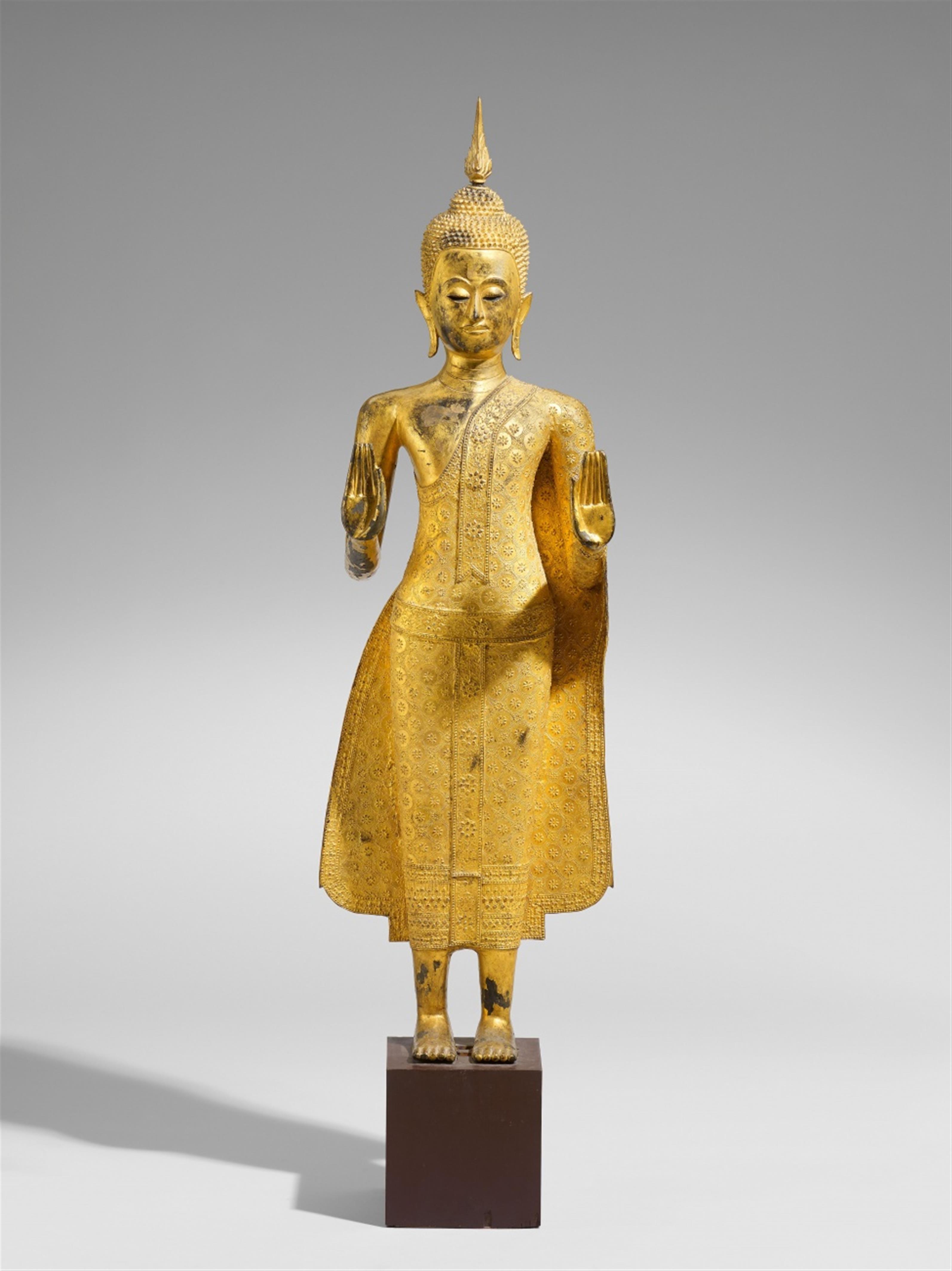 A large Ratanakosin lacquered and gilded bronze figure of a standing Buddha. Early 19th century - image-1