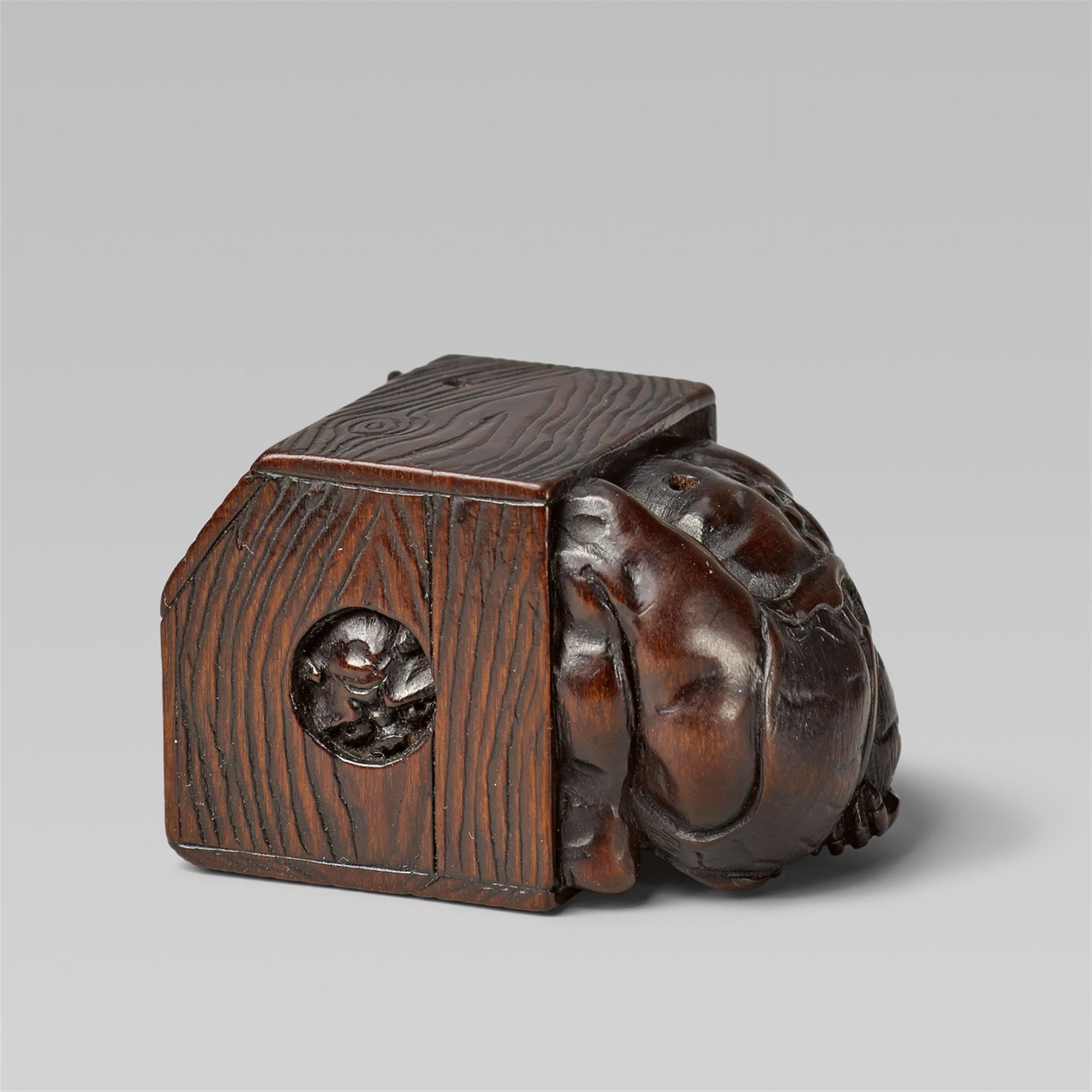 A boxwwod netsuke of an oni in a portable heater, by Masayuki. Mid-19th century - image-1