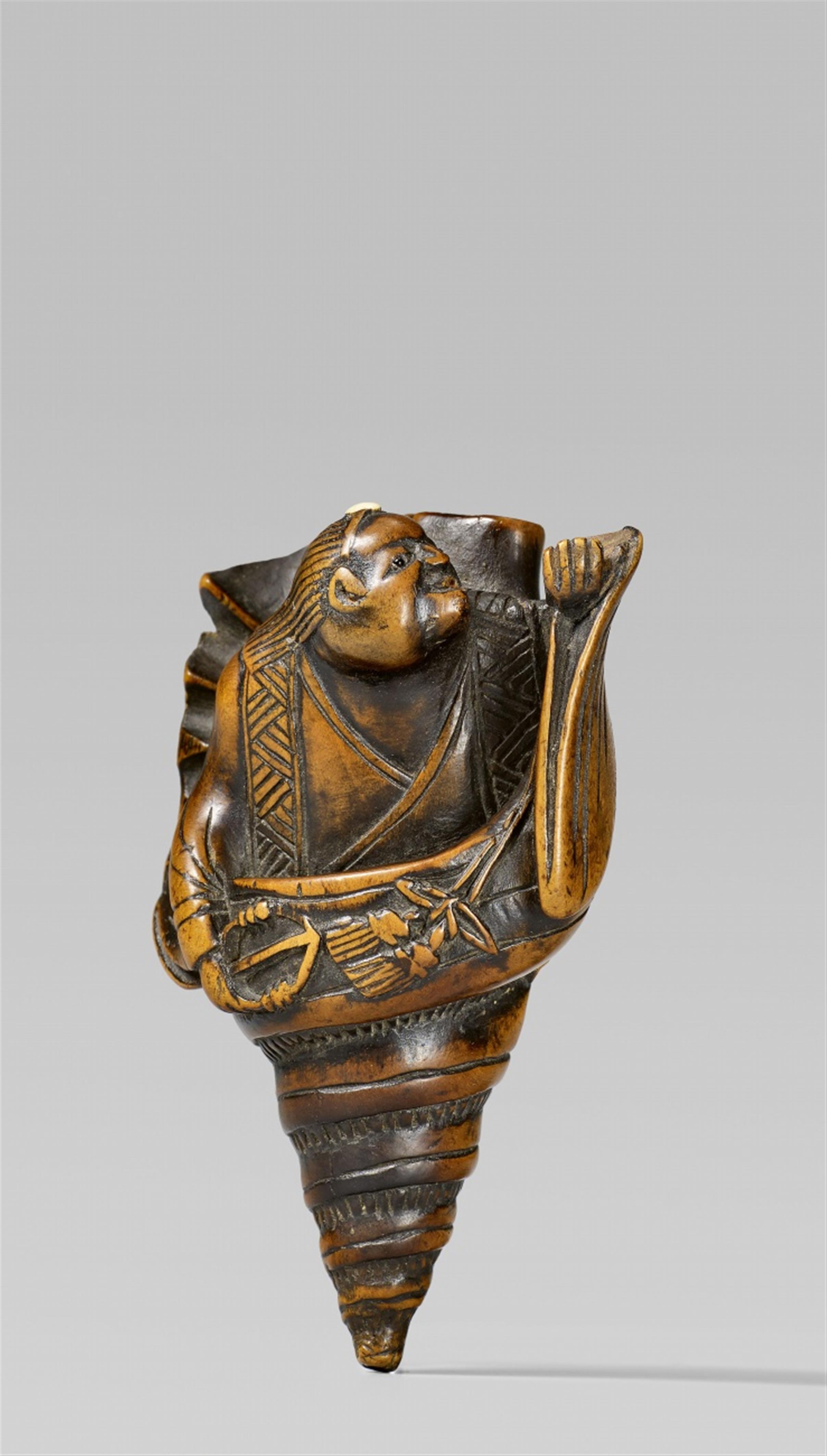 A boxwood netsuke of a yamabushi inside a hora. 19th century - image-1