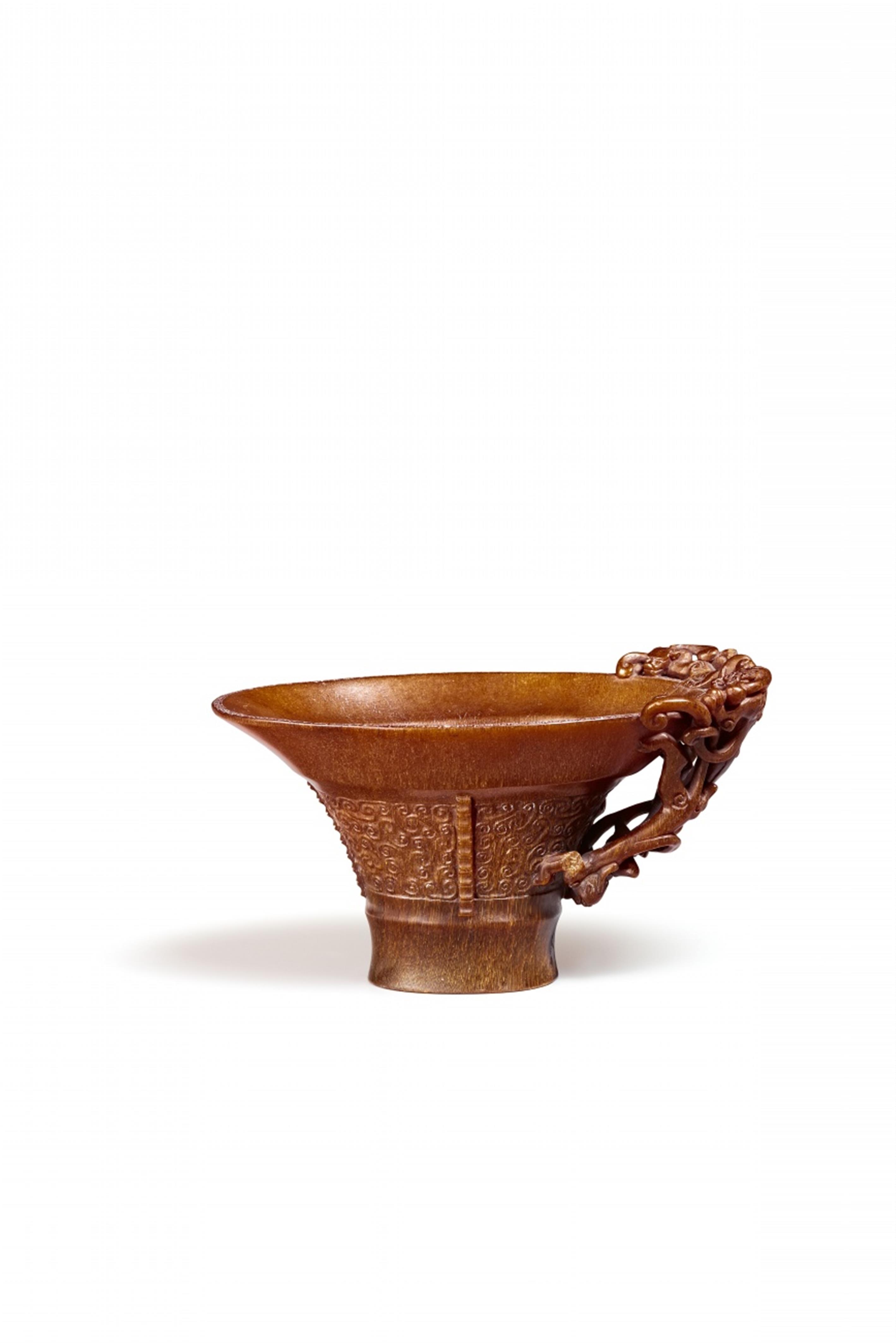 A fine archaistic rhinoceros libation cup. Qing dynasty - image-1
