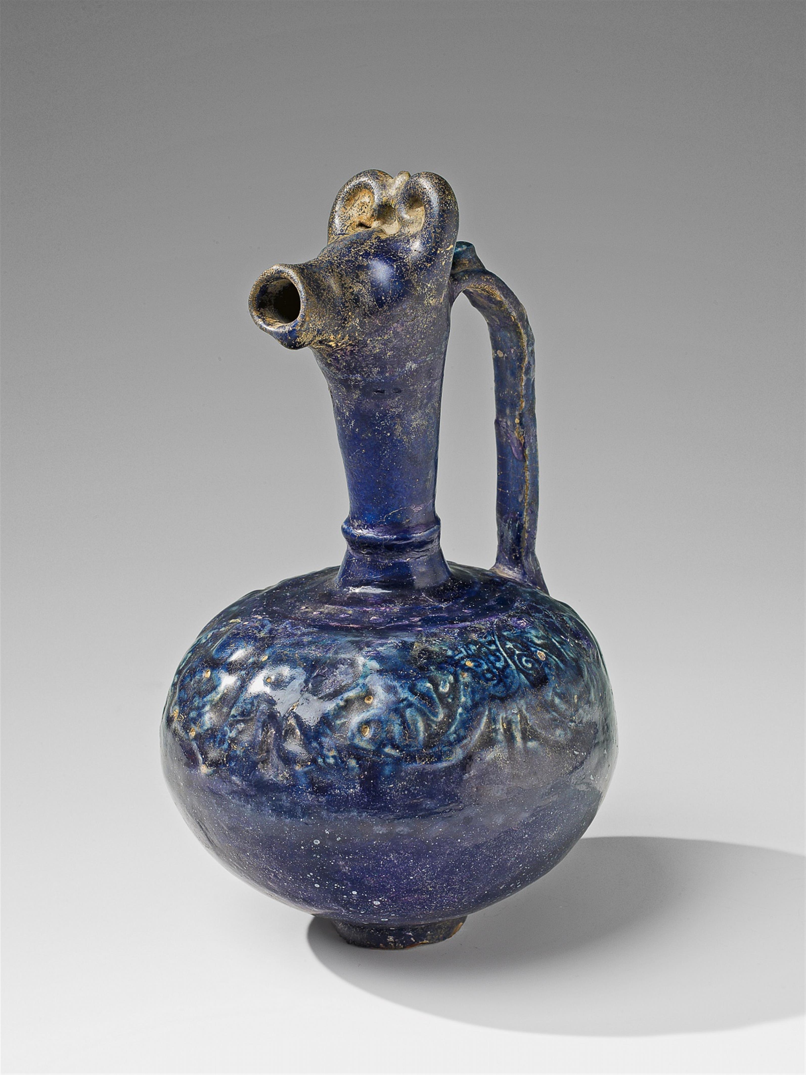 An animal-headed fritware ewer - image-1