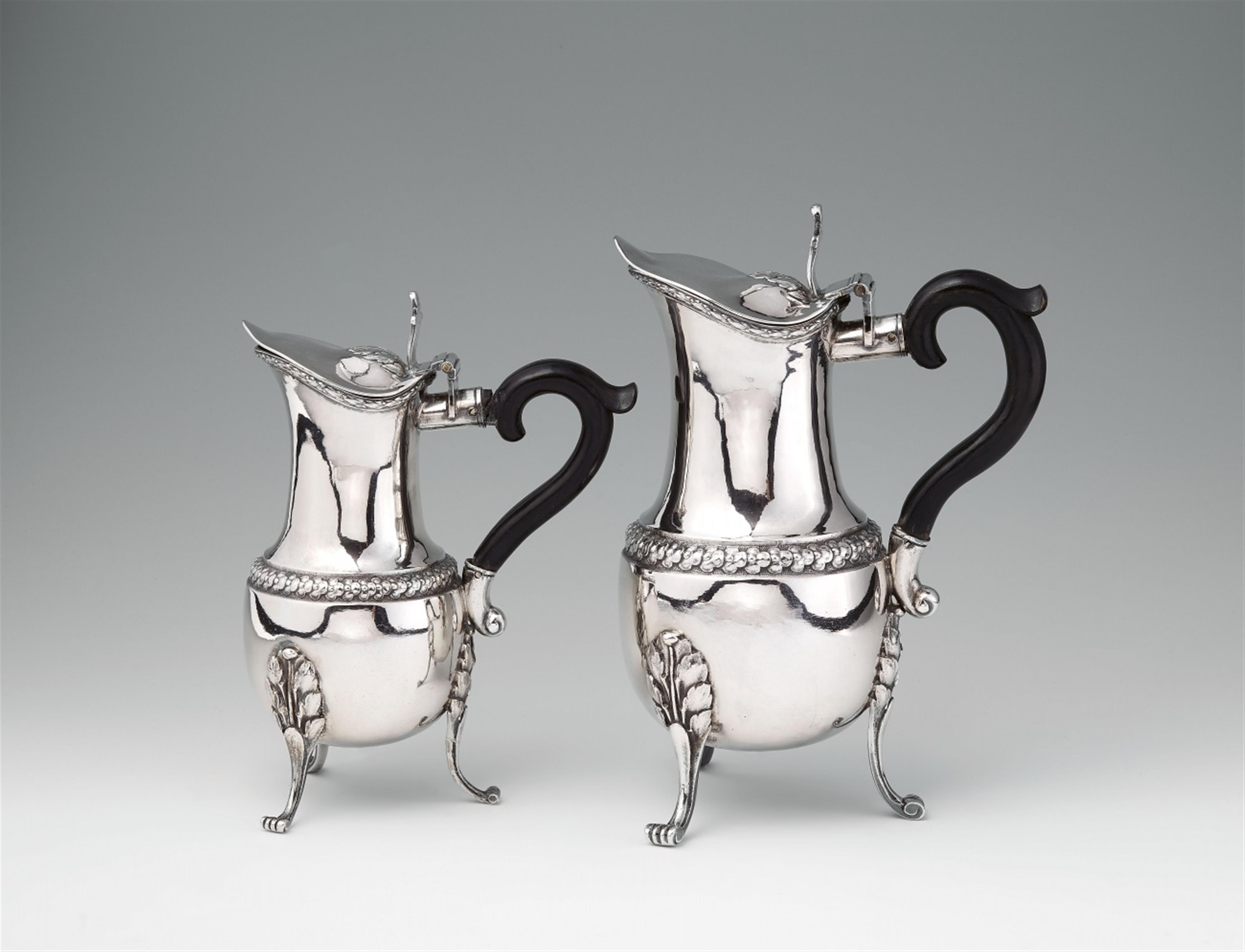 A pair of Augsburg silver pitchers - image-1