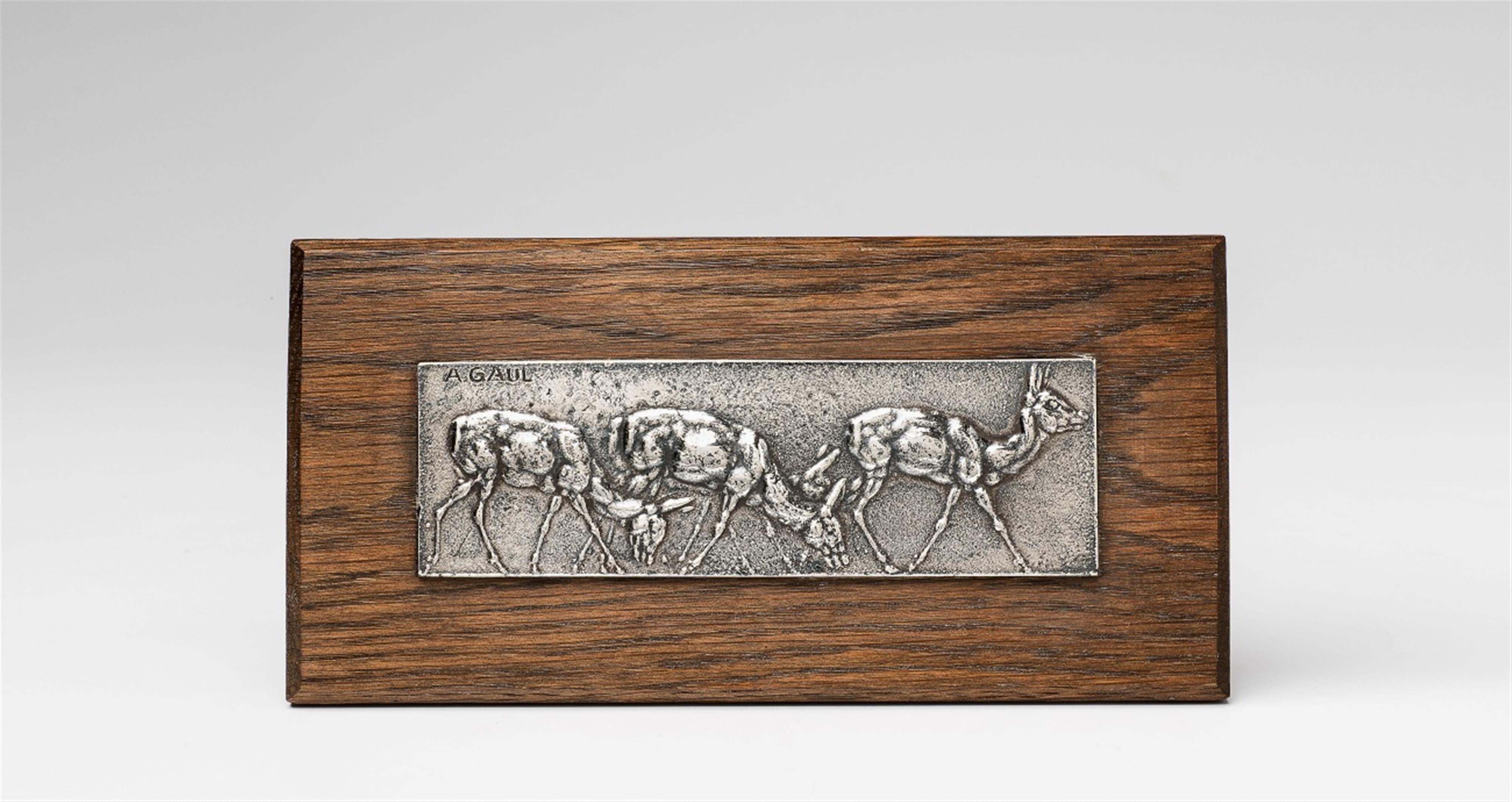 A silver relief with four deer - image-1