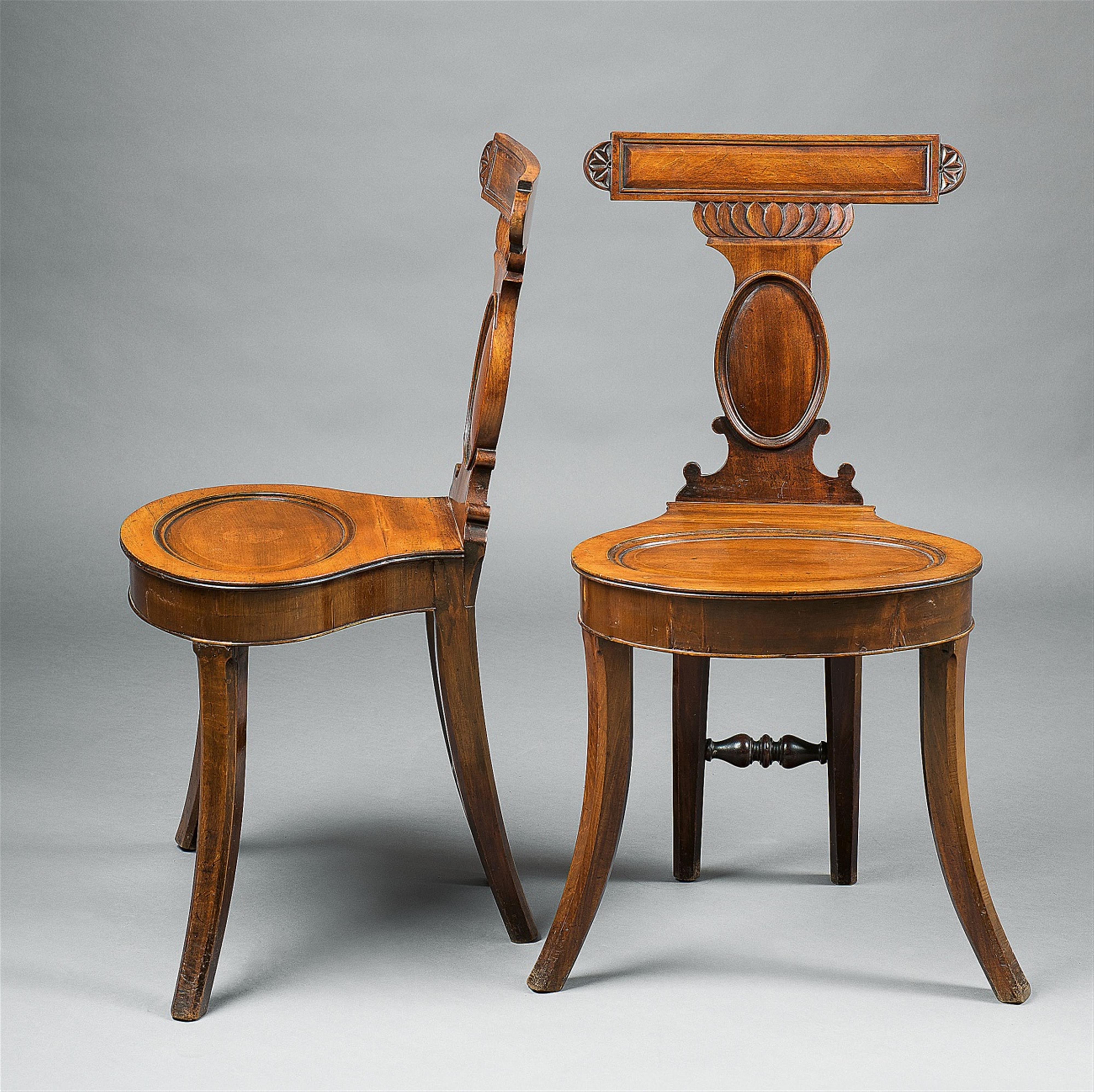 A pair of unusual mahogany chairs - image-1