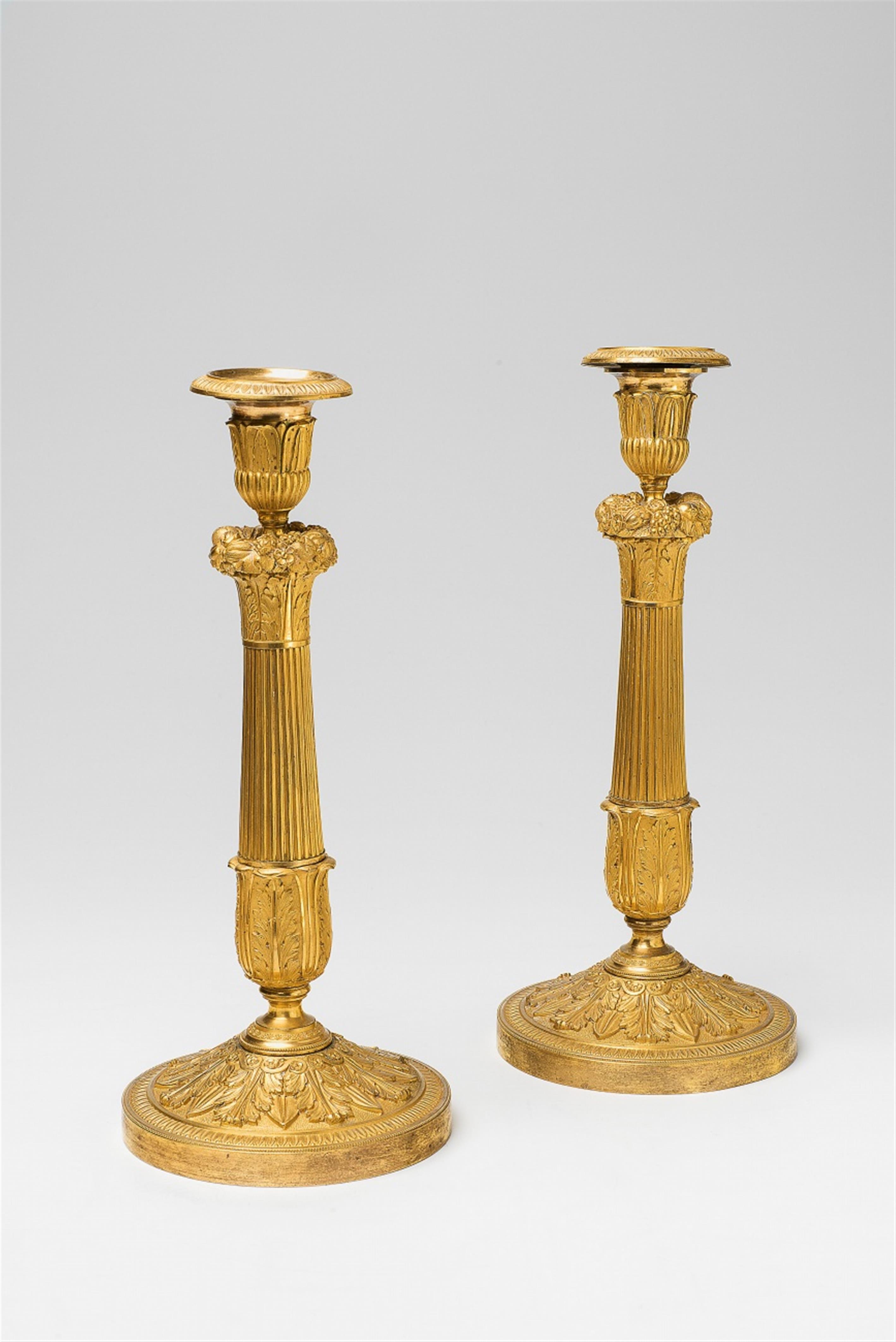 A pair of Neoclassical ormolu candlesticks - image-1