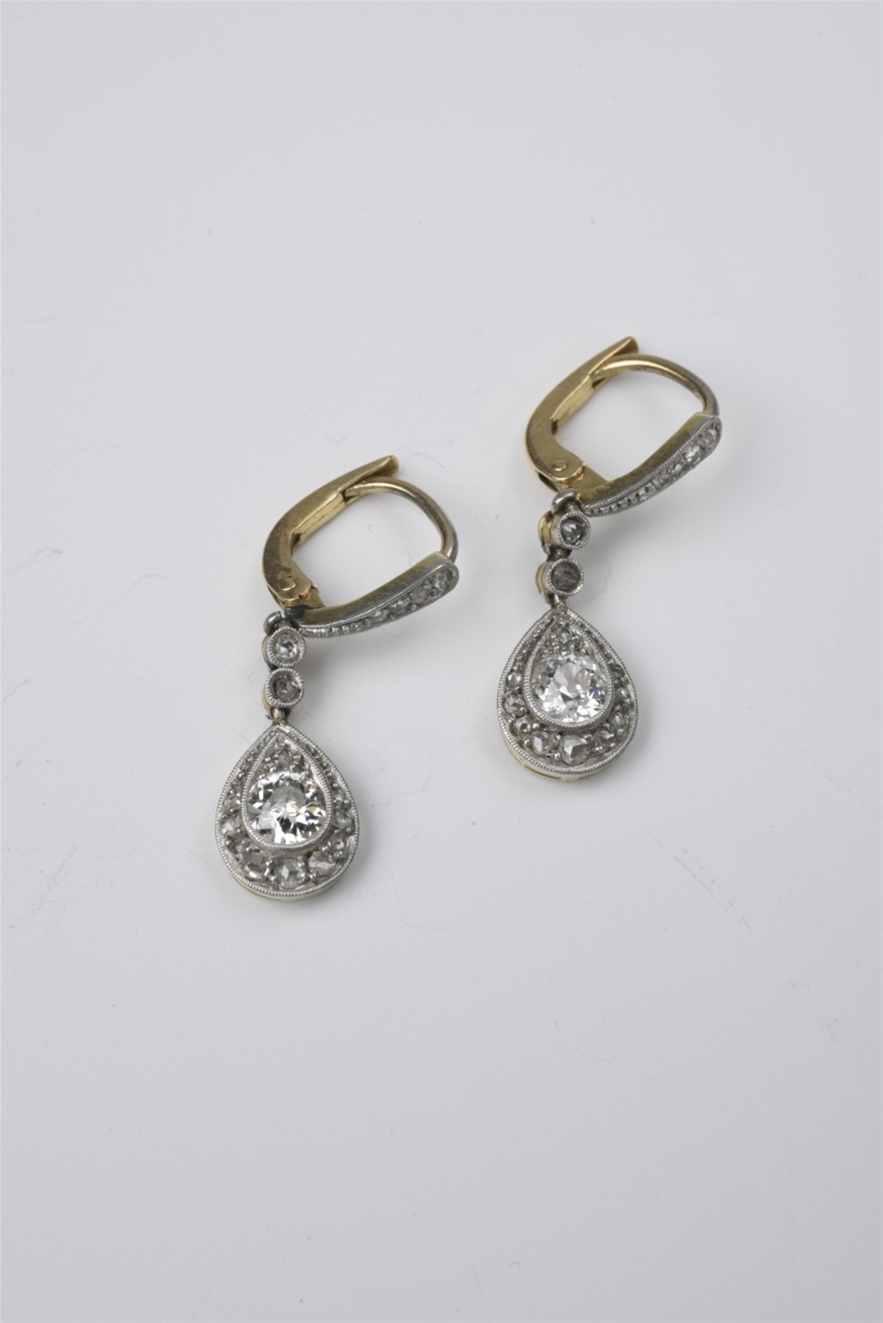 A pair of 14k gold, platinum, and diamond pendant earrings - image-1