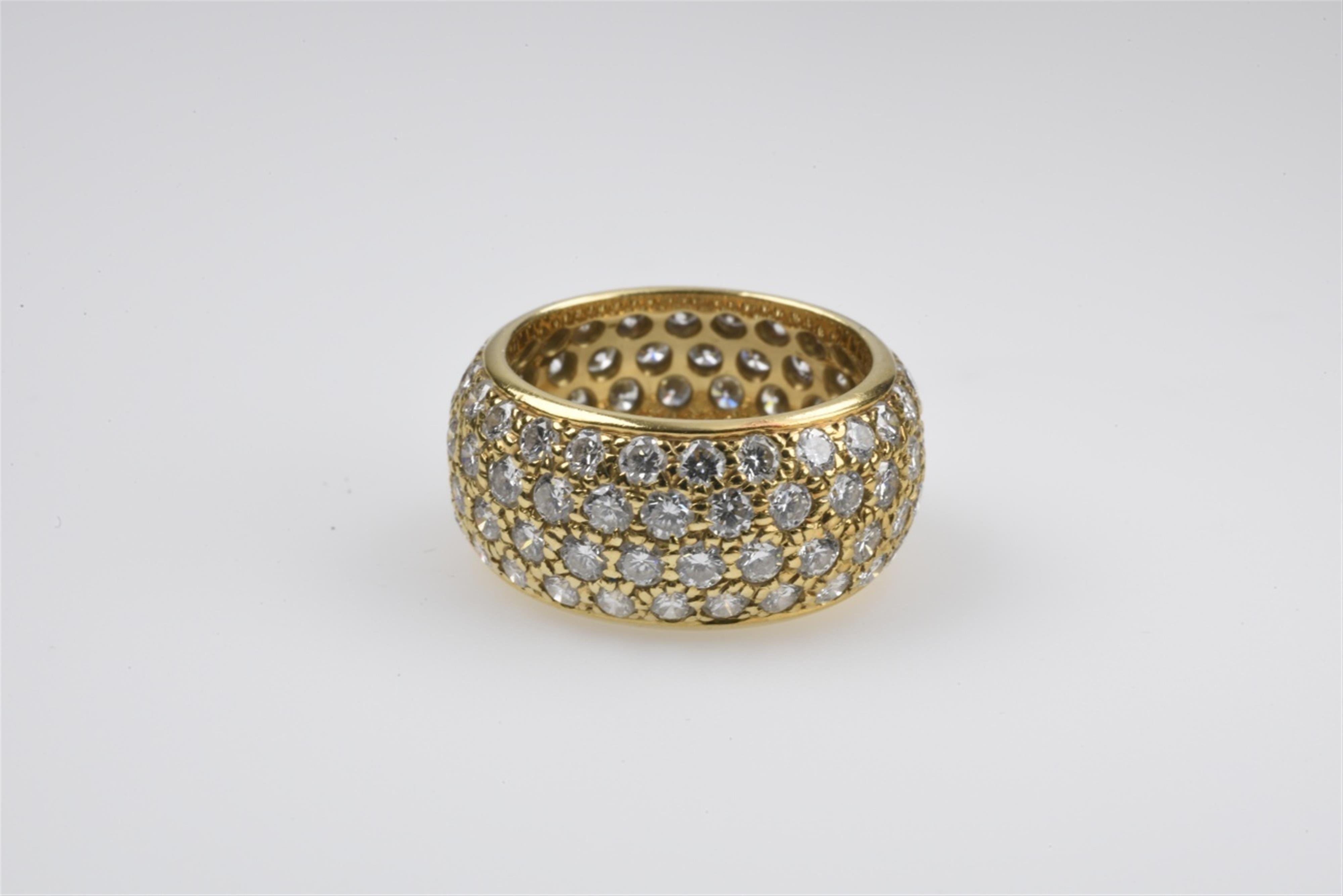 An 18k gold and diamond memory ring - image-1