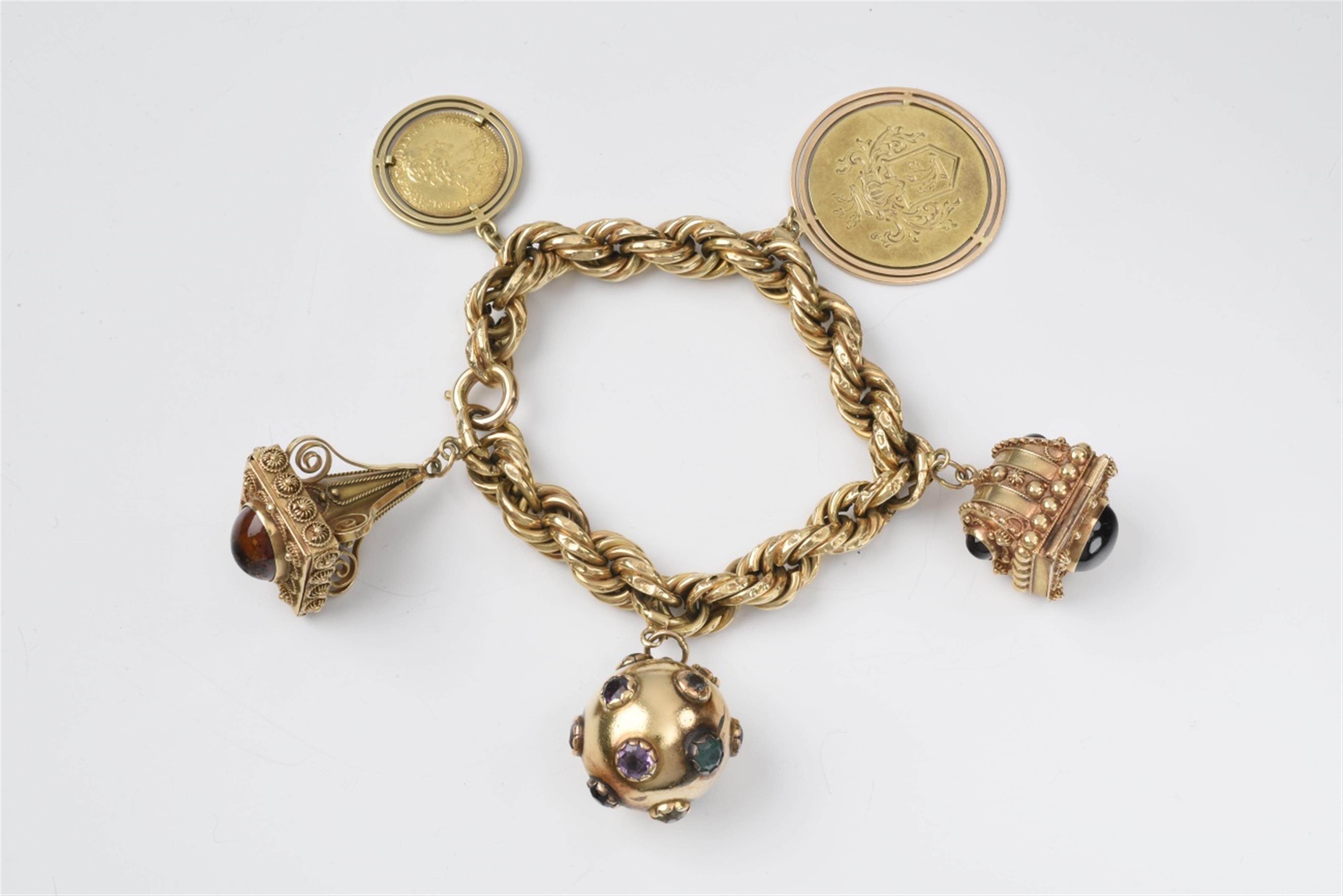 A gold charm bracelet with a Cologne gold coin - image-1
