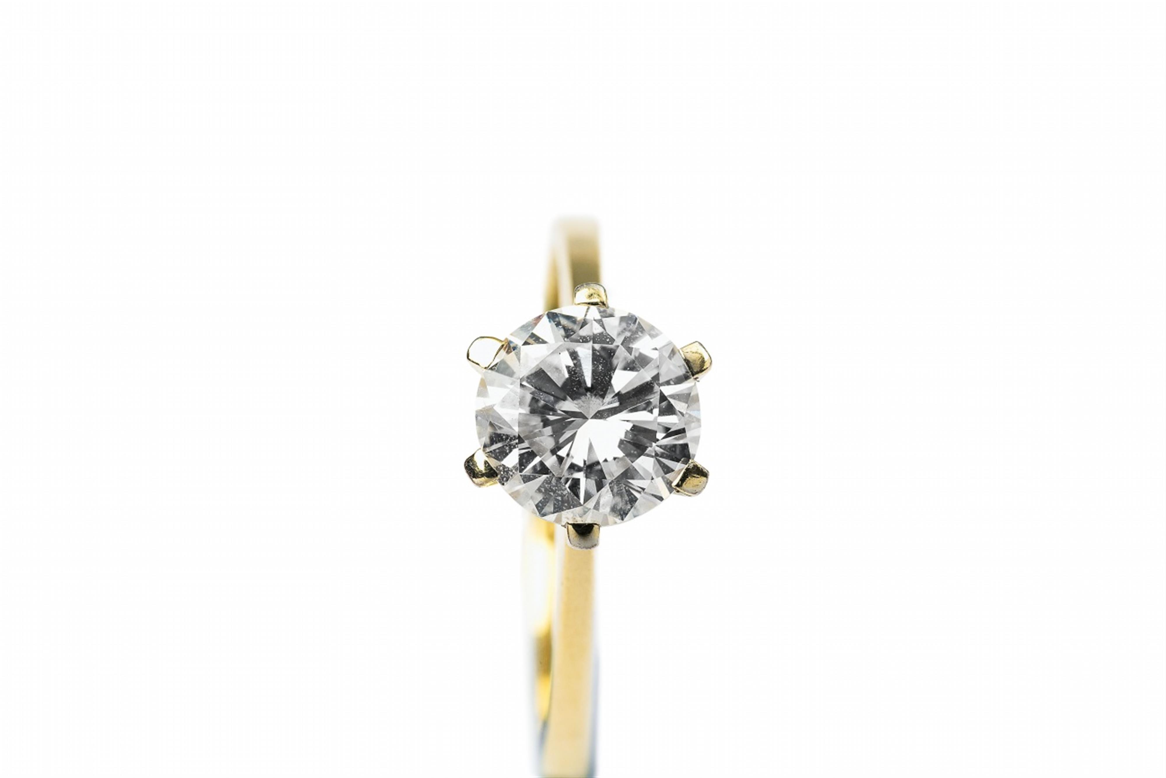 A small 14k gold solitaire diamond ring - image-2