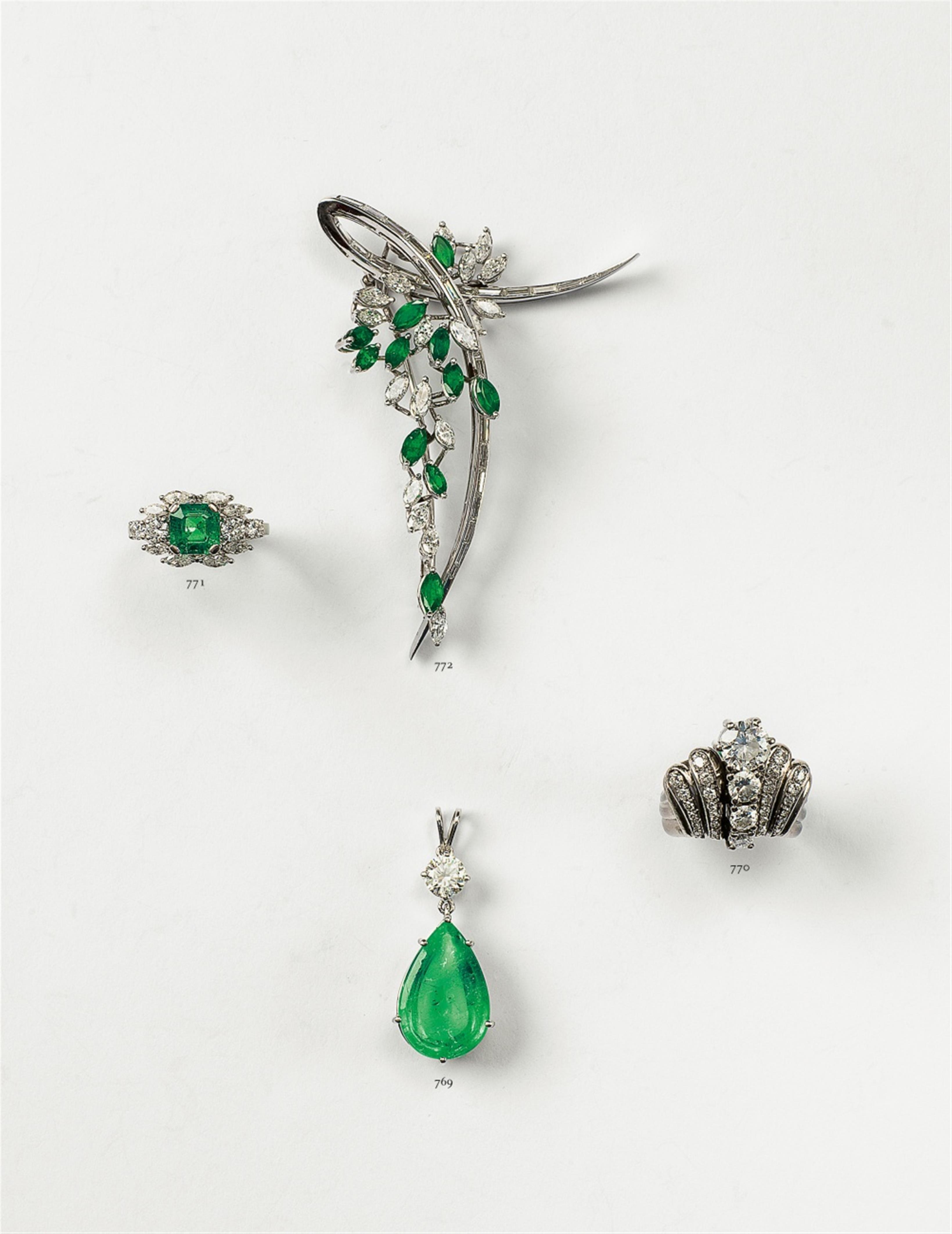 An 18k white gold and emerald pendant - image-2