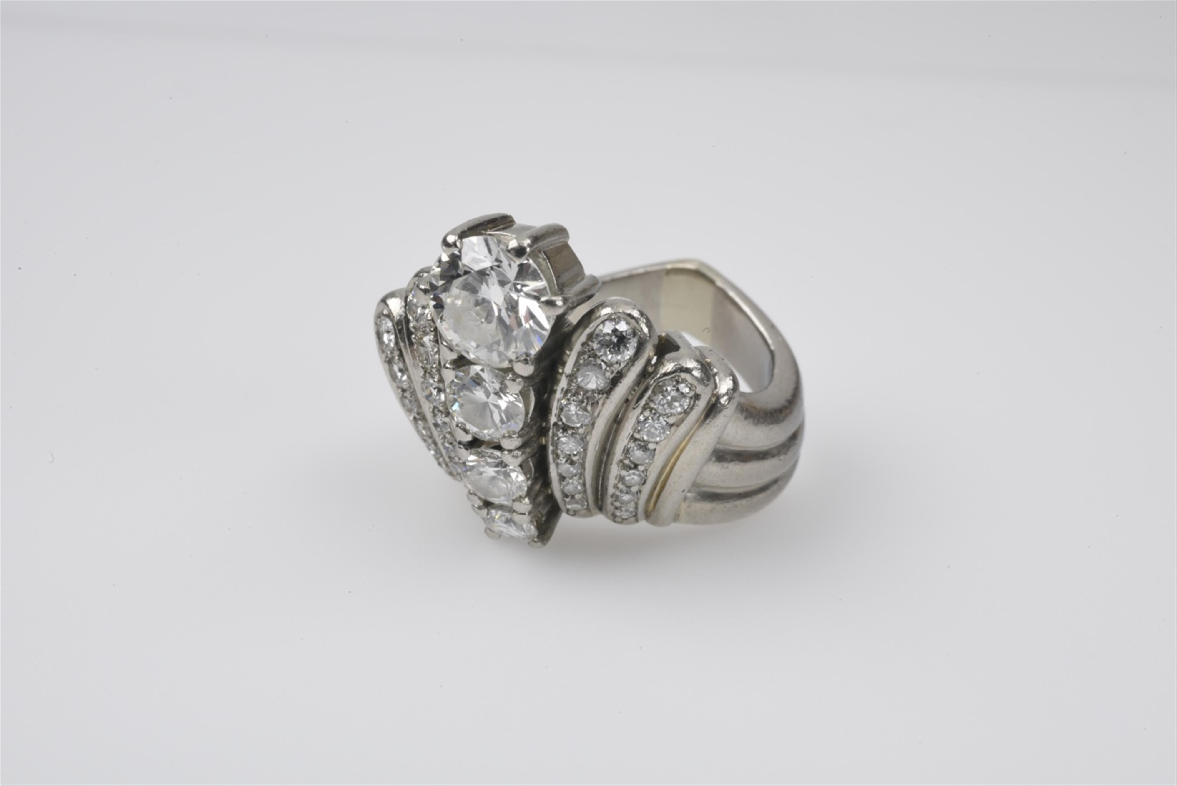 A retro platinum and diamond ring - image-1