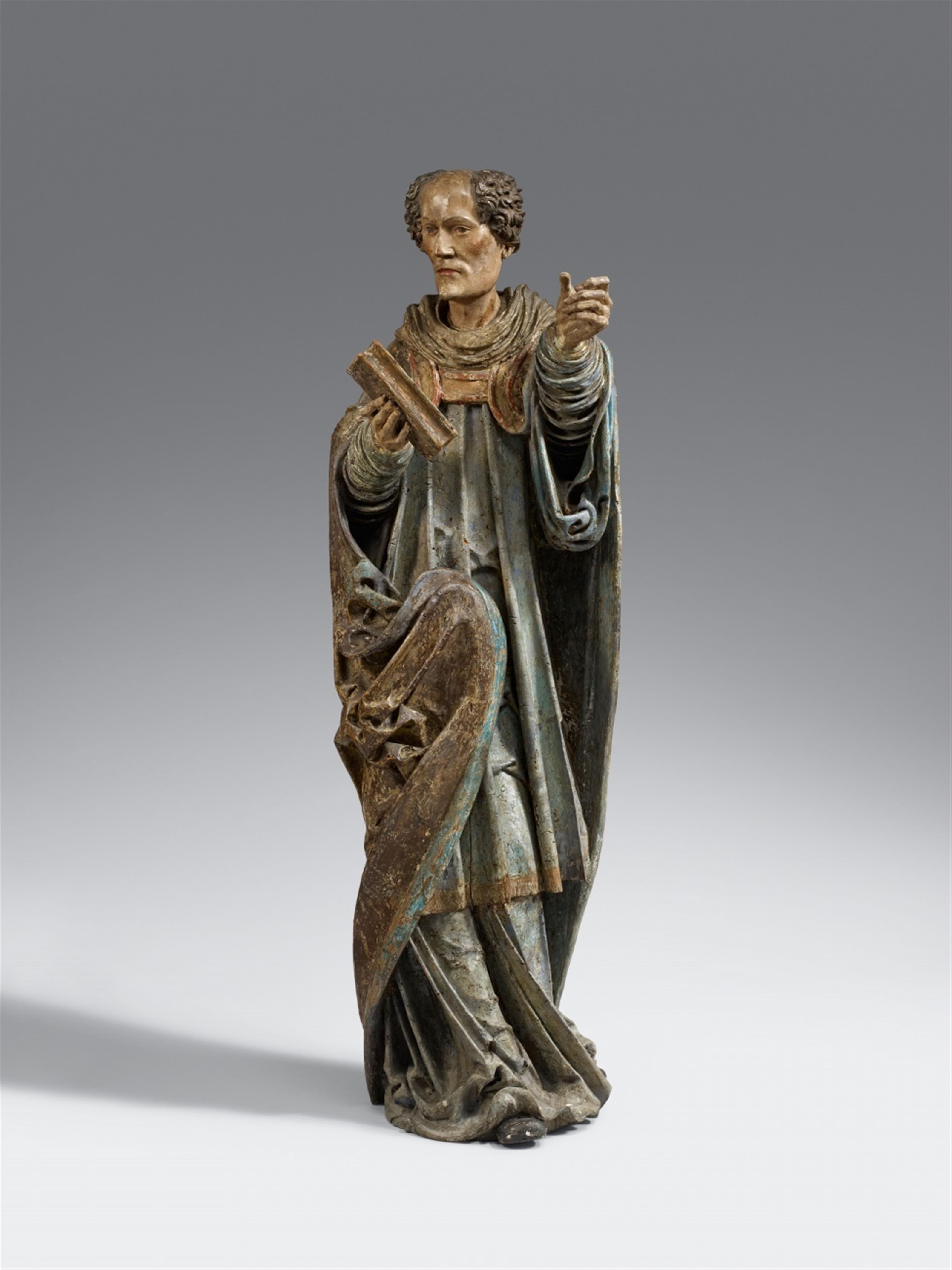 Austria circa 1510/1520 - An Austrian carved wooden figure of a saint with a book, circa 1510/1520 - image-1