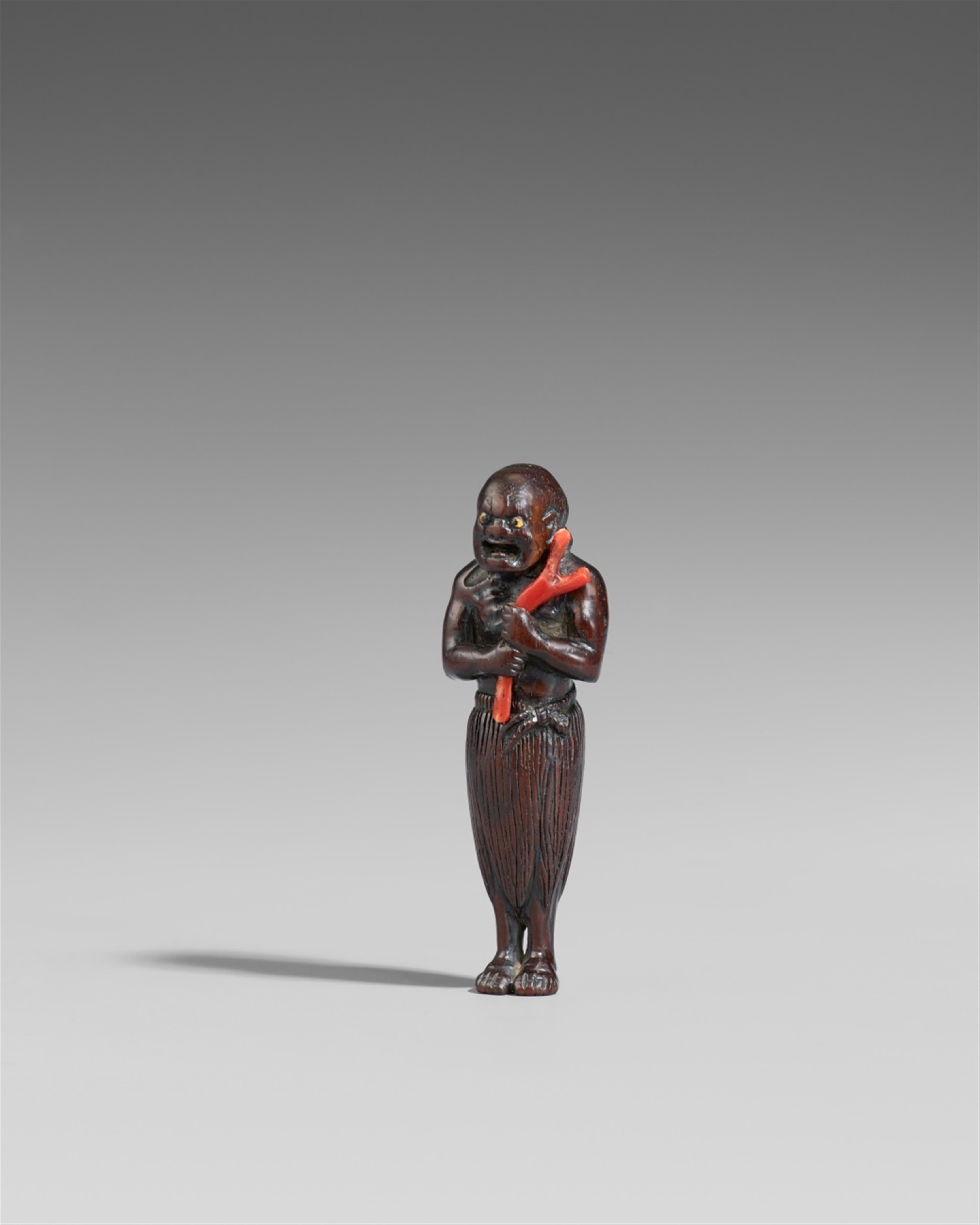 A fruit wood netsuke of a standing kuronbôjin. 19th century - image-1