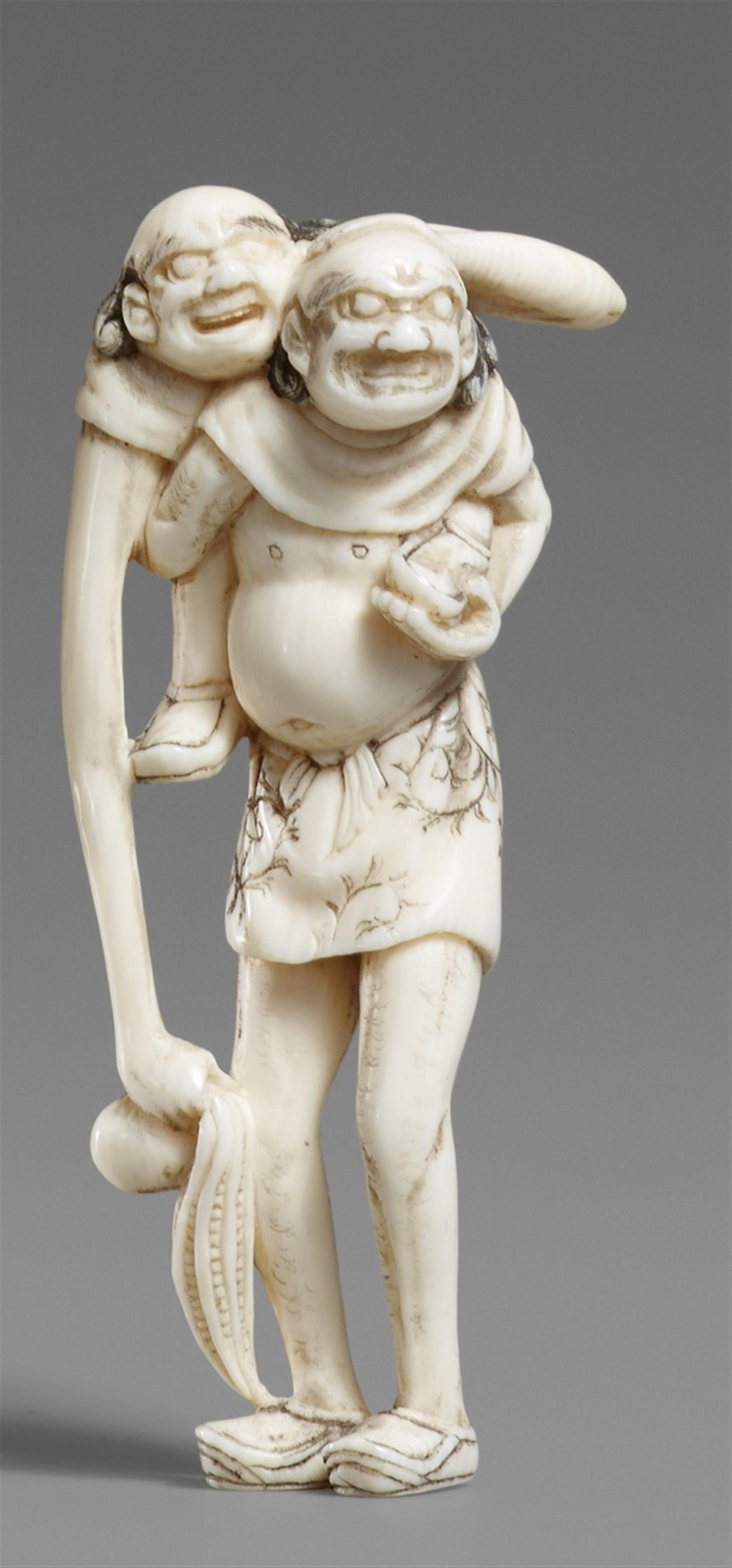 An ivory netsuke of an ashinaga and tenaga. Late 19th century - image-1