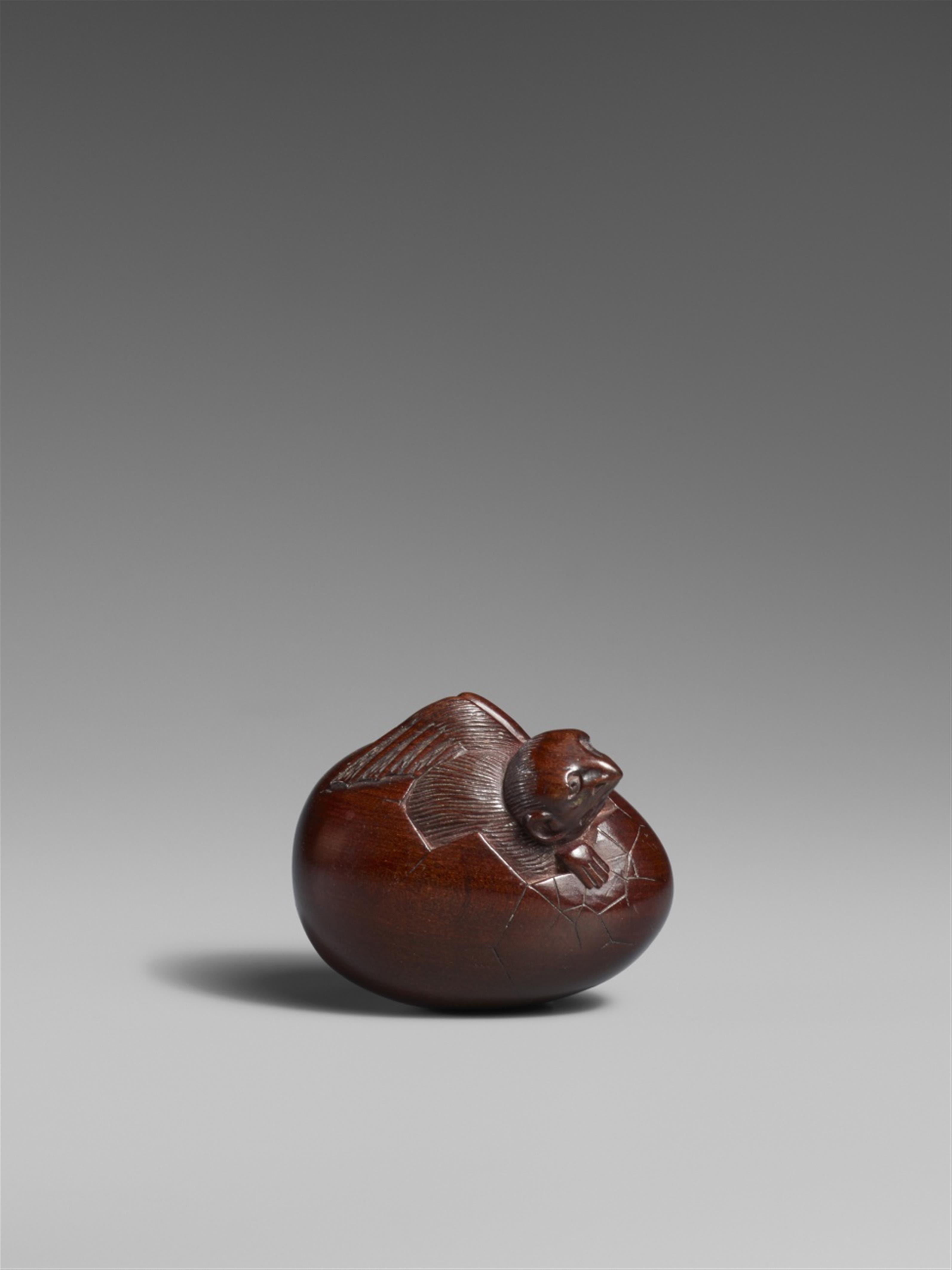 A boxwood netsuke of a karasu tengu hatching from an egg. Mid-19th century - image-1