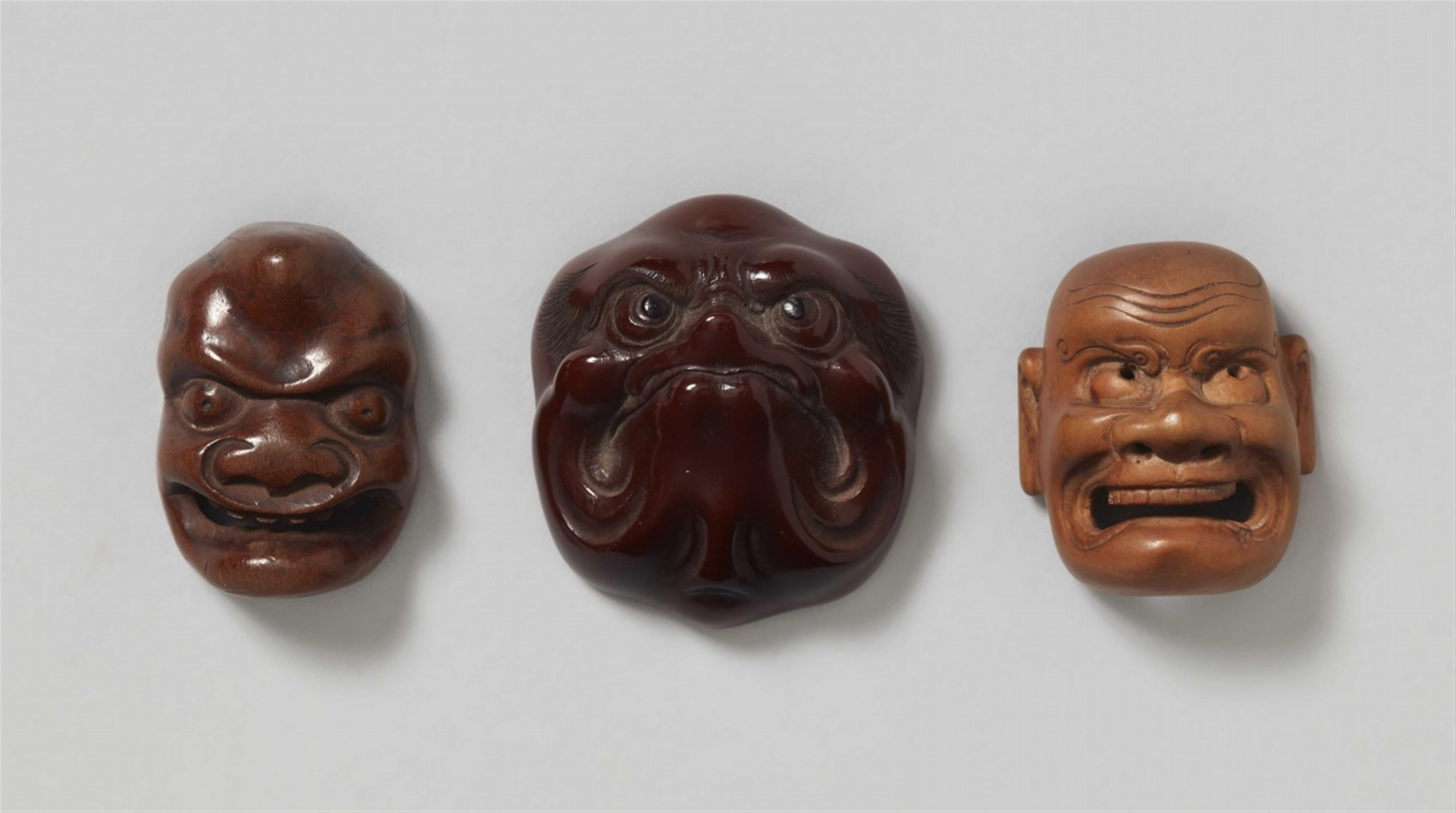 A group of three wooden mask netsuke. 19th century - image-1