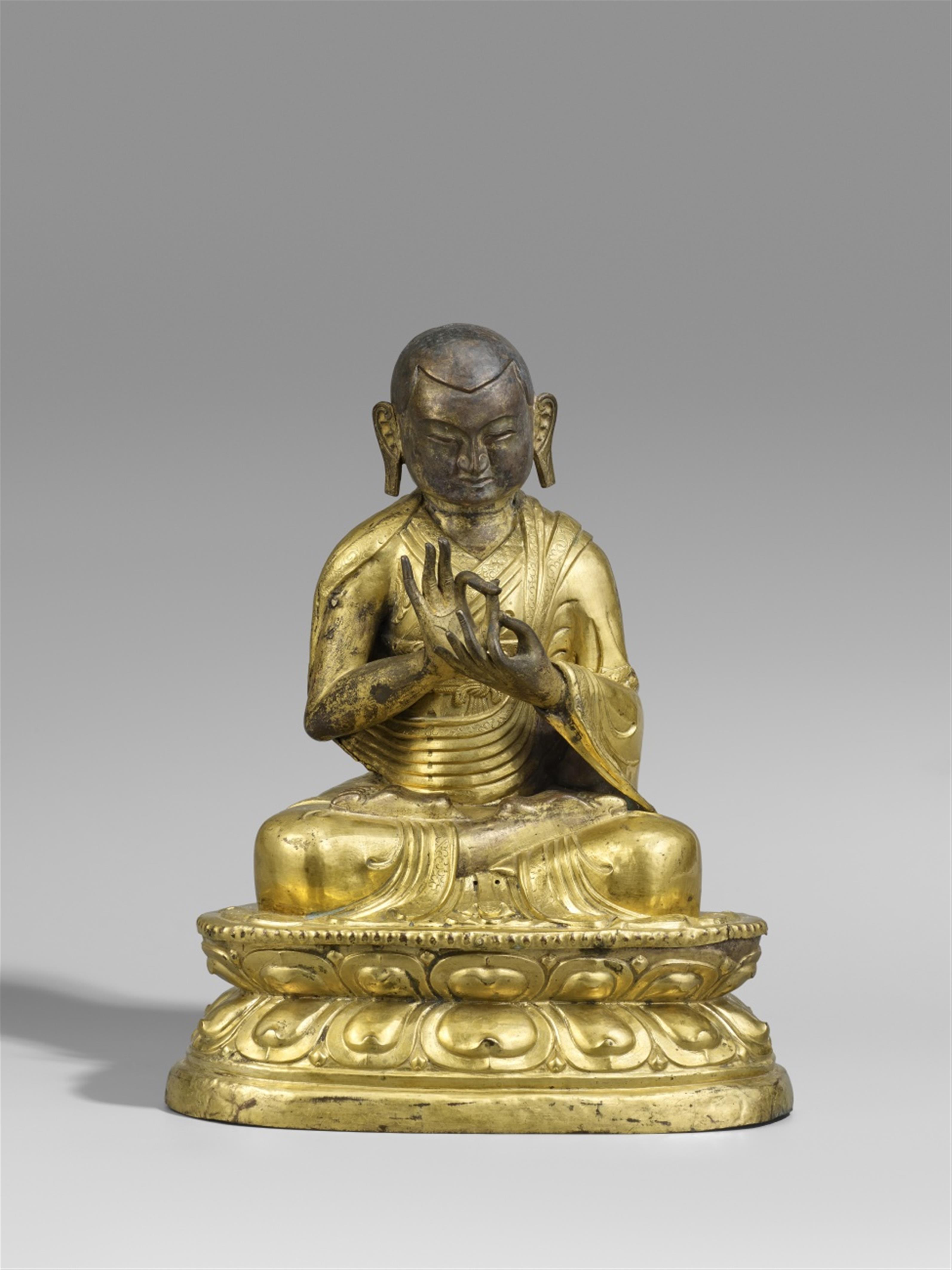 A Sinotibetan gilt copper repousé figure of a high Shakyapa lama. 19th century - image-1