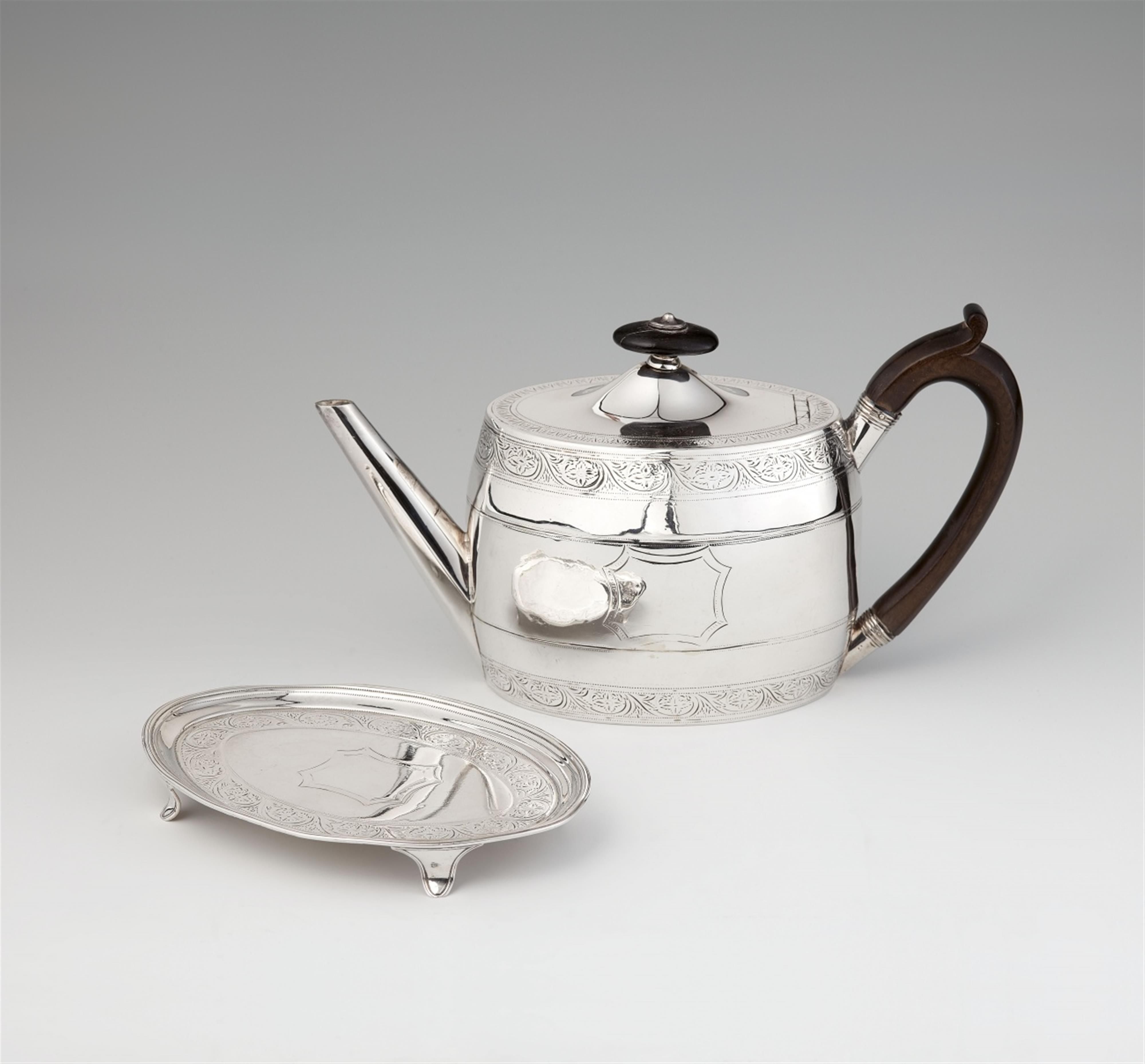 A George III teapot and stand - image-1