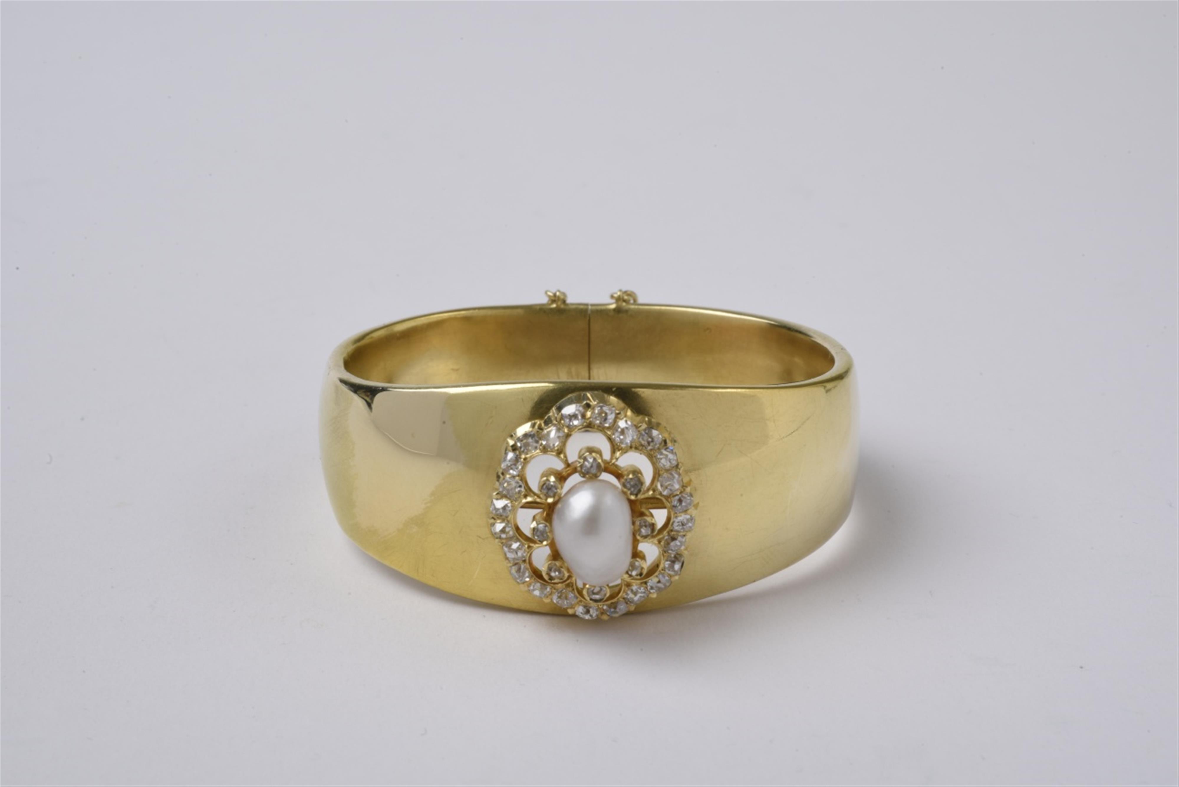 An 18k gold and Oriental pearl bangle - image-1