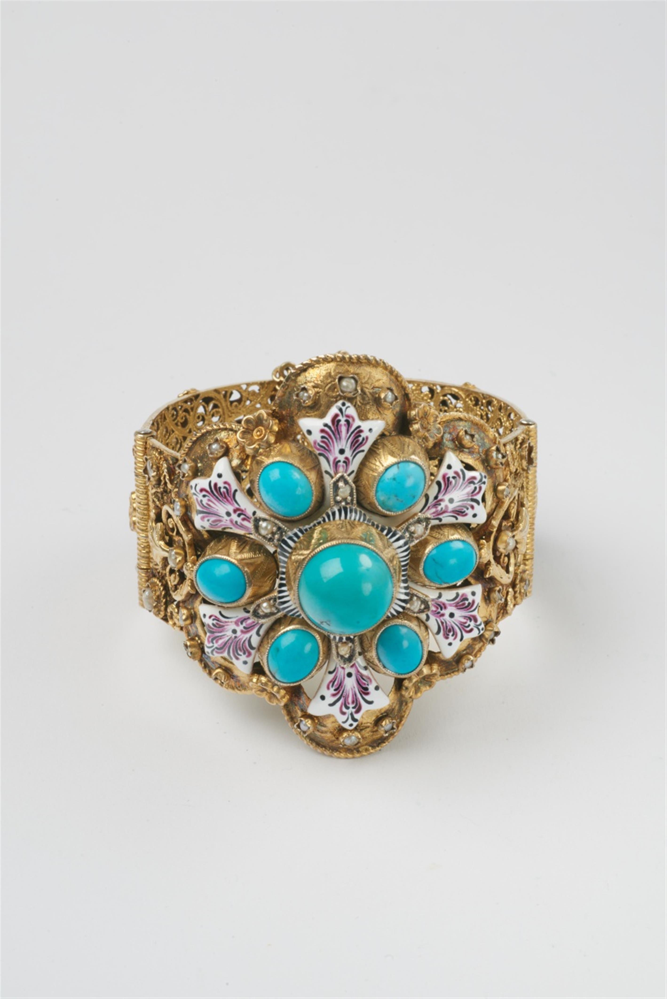 A Historicist silver gilt enamel and turquoise bangle - image-1