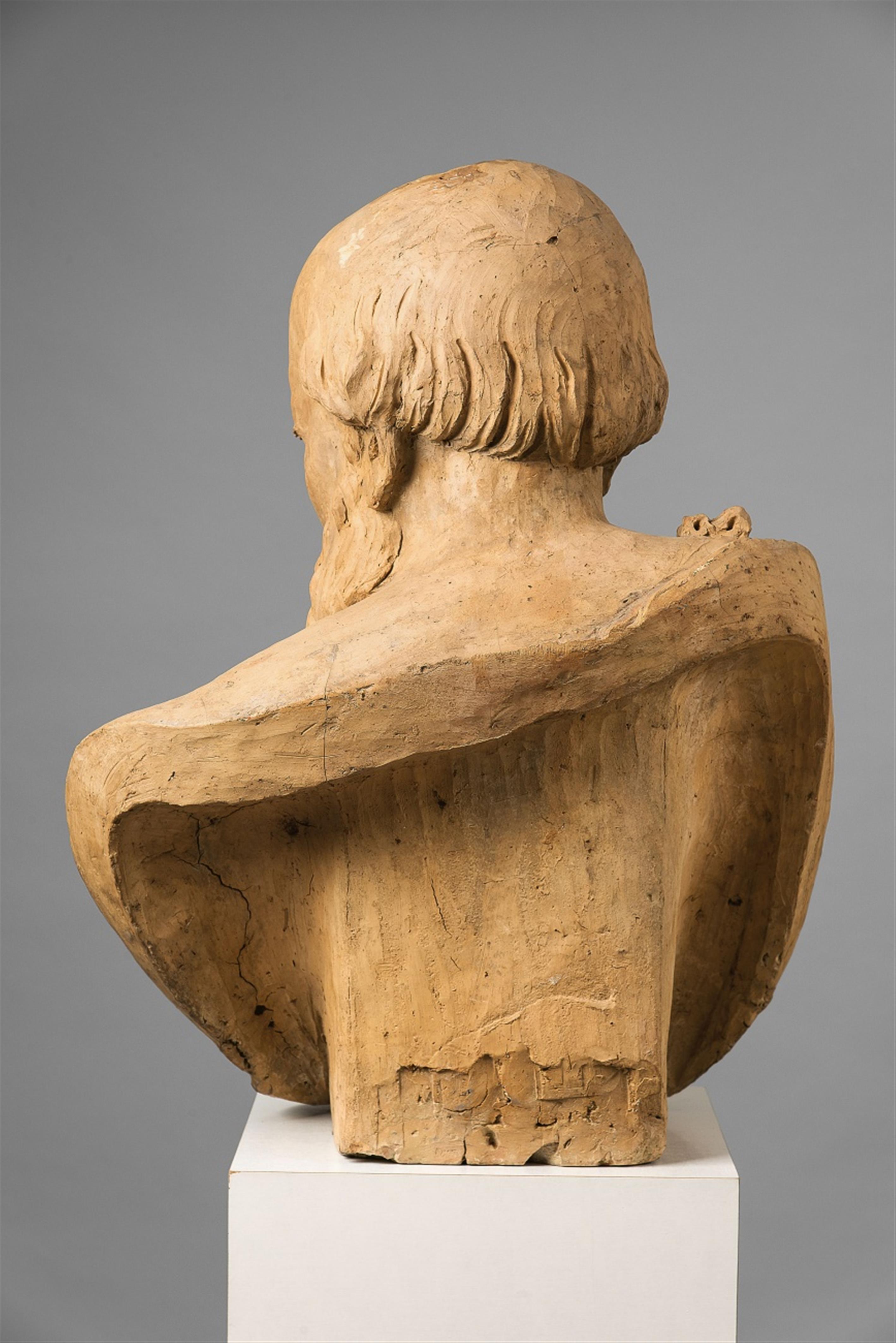 A monumental terracotta bust of an older man - image-2