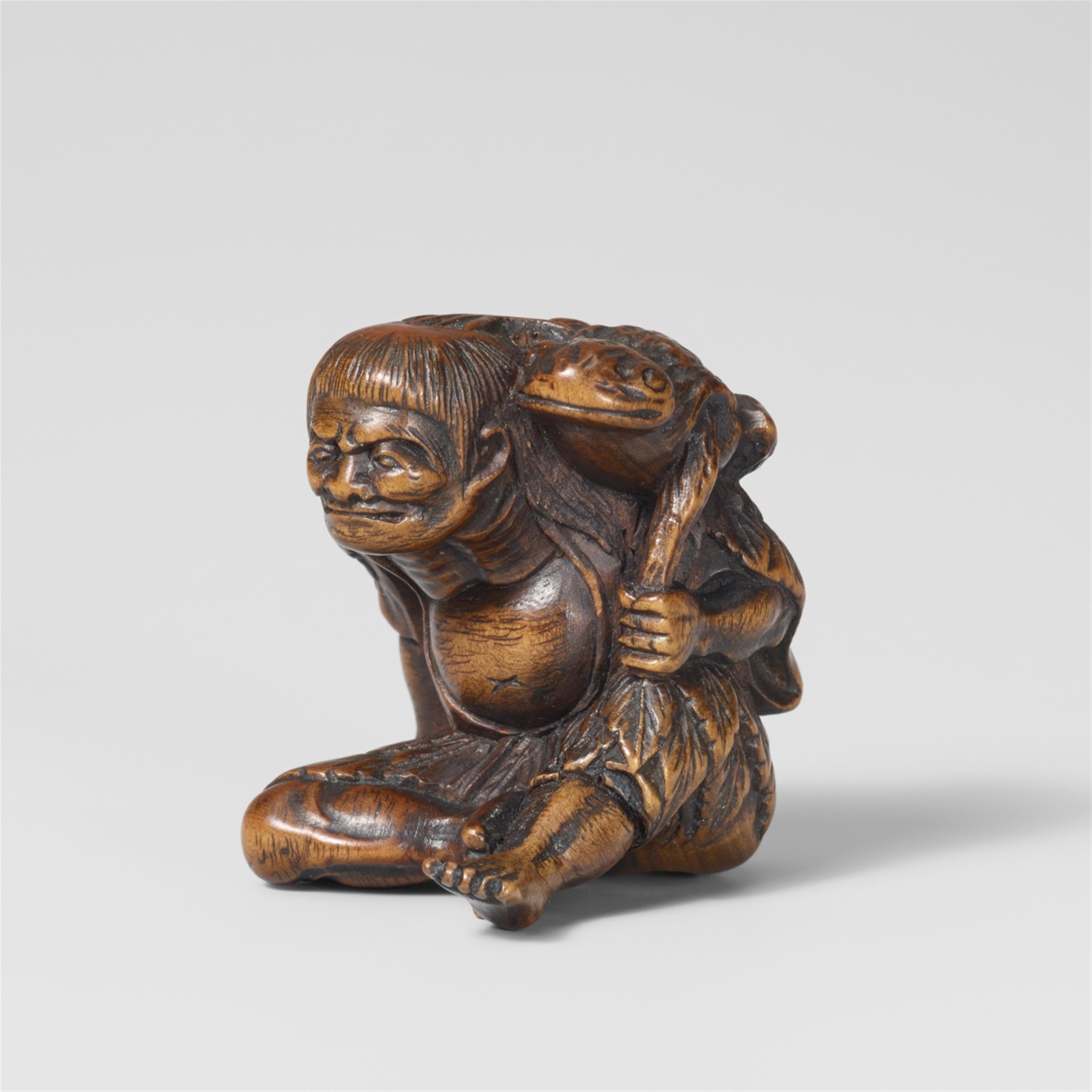 A boxwood netsuke of a grumpy Gama Sennin. Mid-19th century - image-1