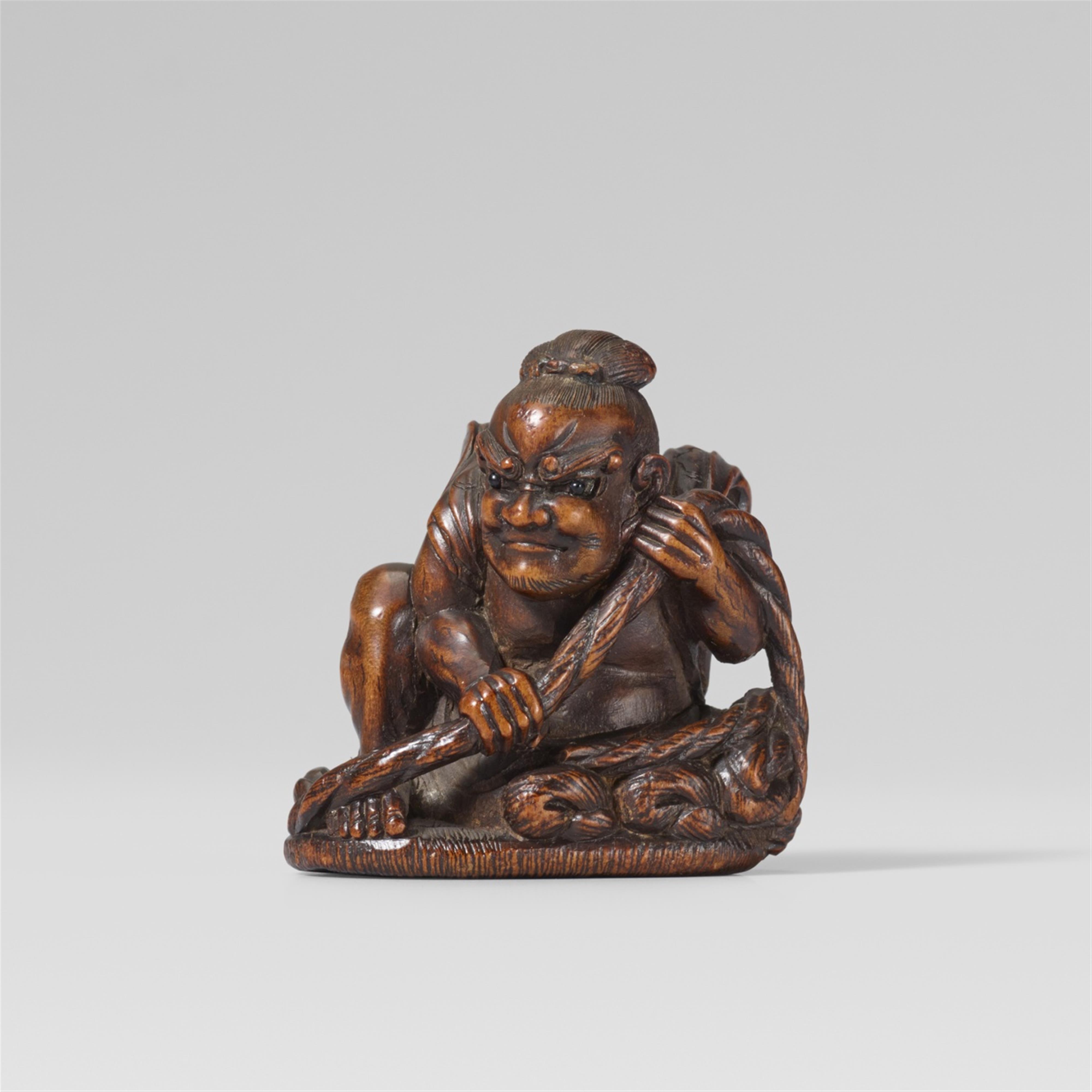 A Hida school wood netsuke of a Niô on a waraji, by Suketada. Late 19th century - image-1