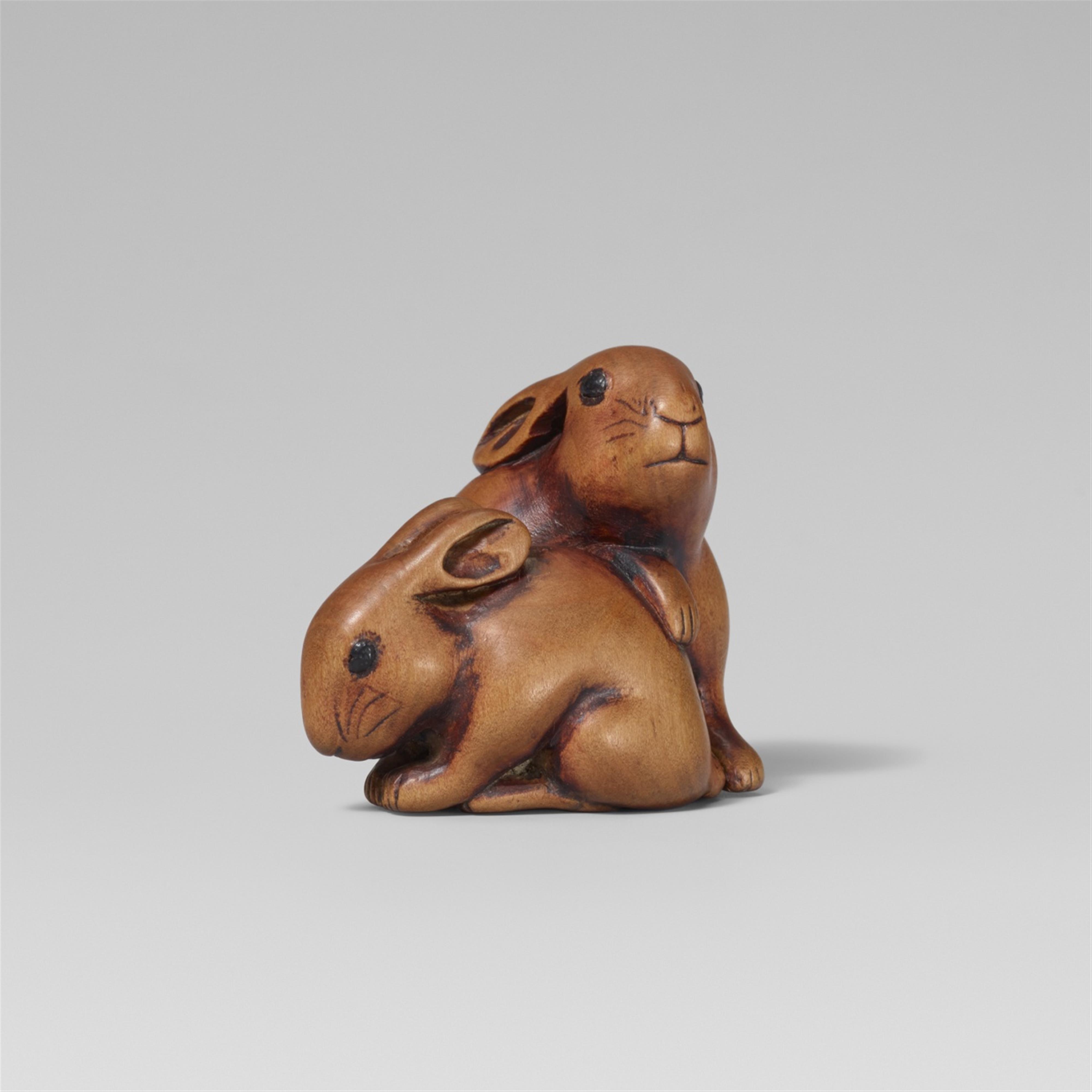 A boxwood netsuke of two hares. 19th century - image-1