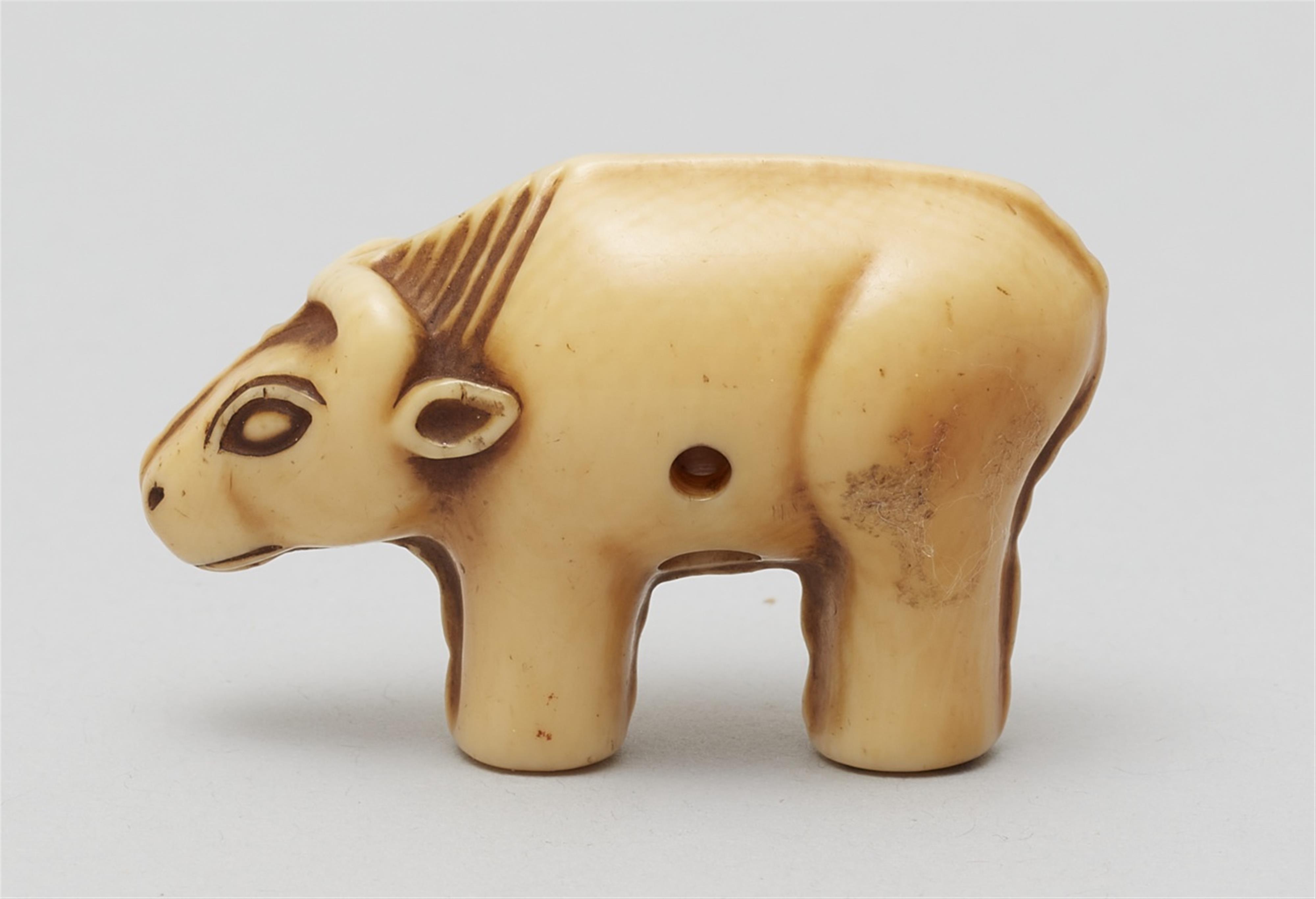 An Osaka school ivory netsuke of a toy figurine of an ox. Mid-19th century - image-2