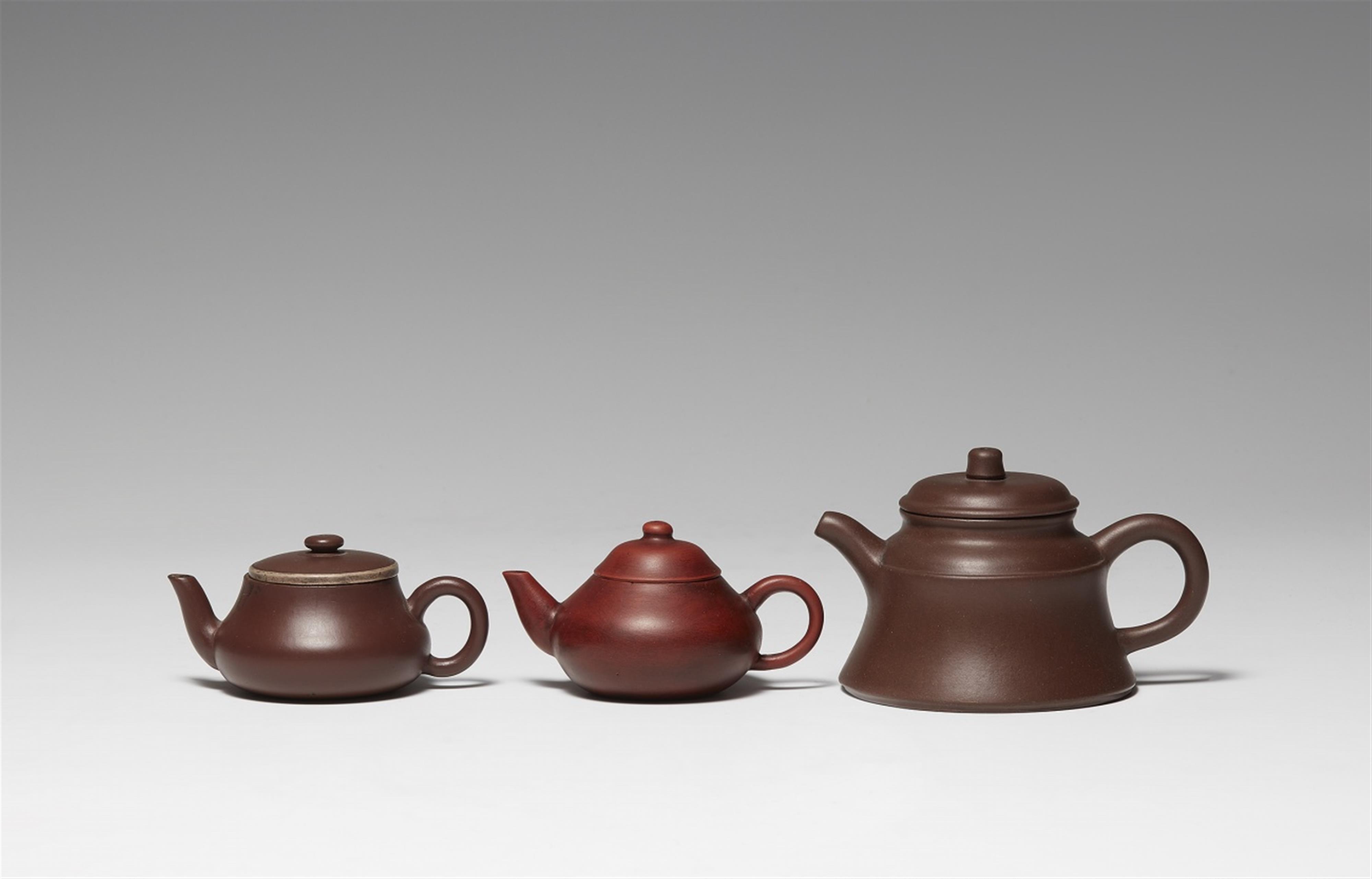 A group of three Yixing teapots and covers. Qing dynasty (1644-1911) and later - image-1