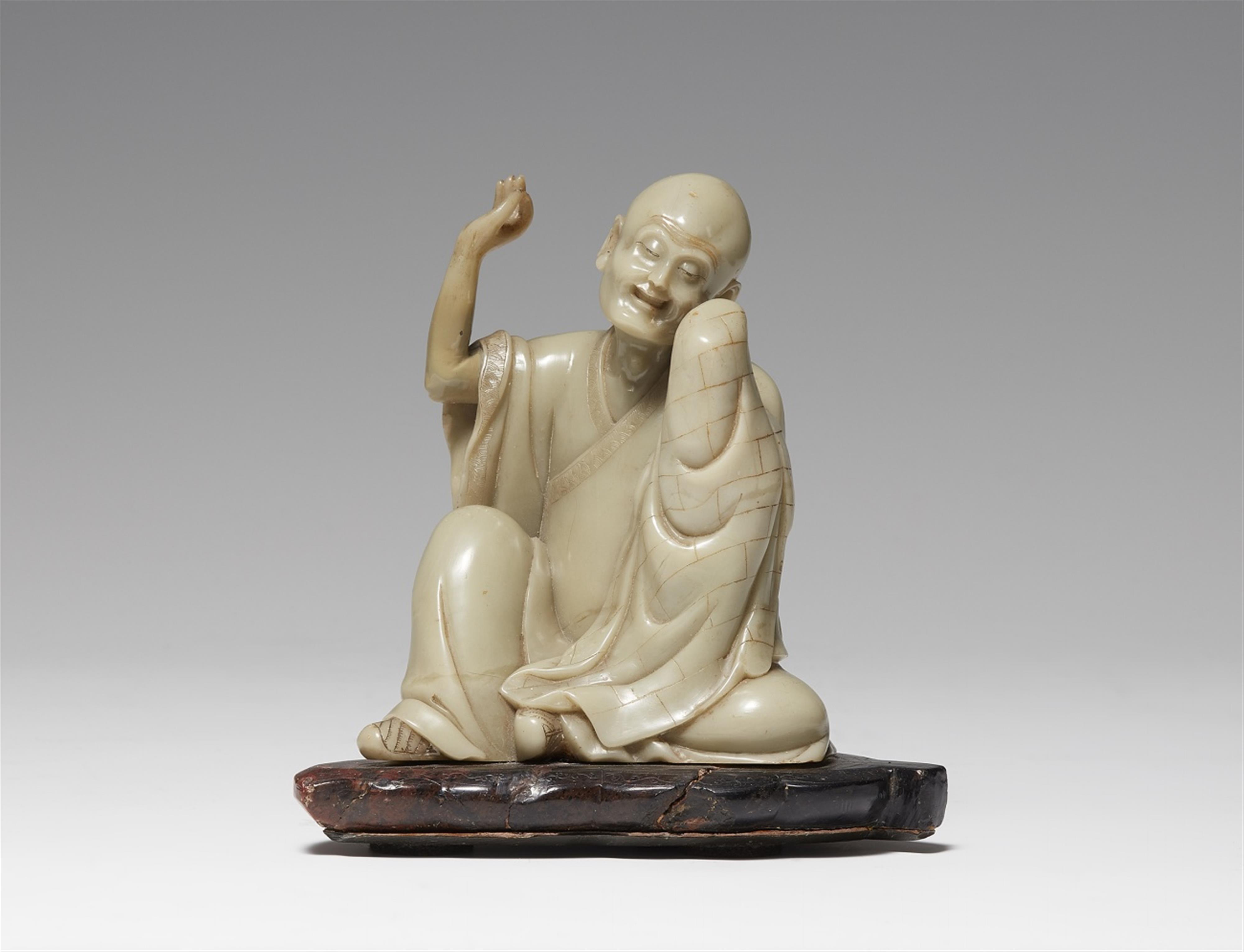 A light green soapstone figure of a luohan - image-1