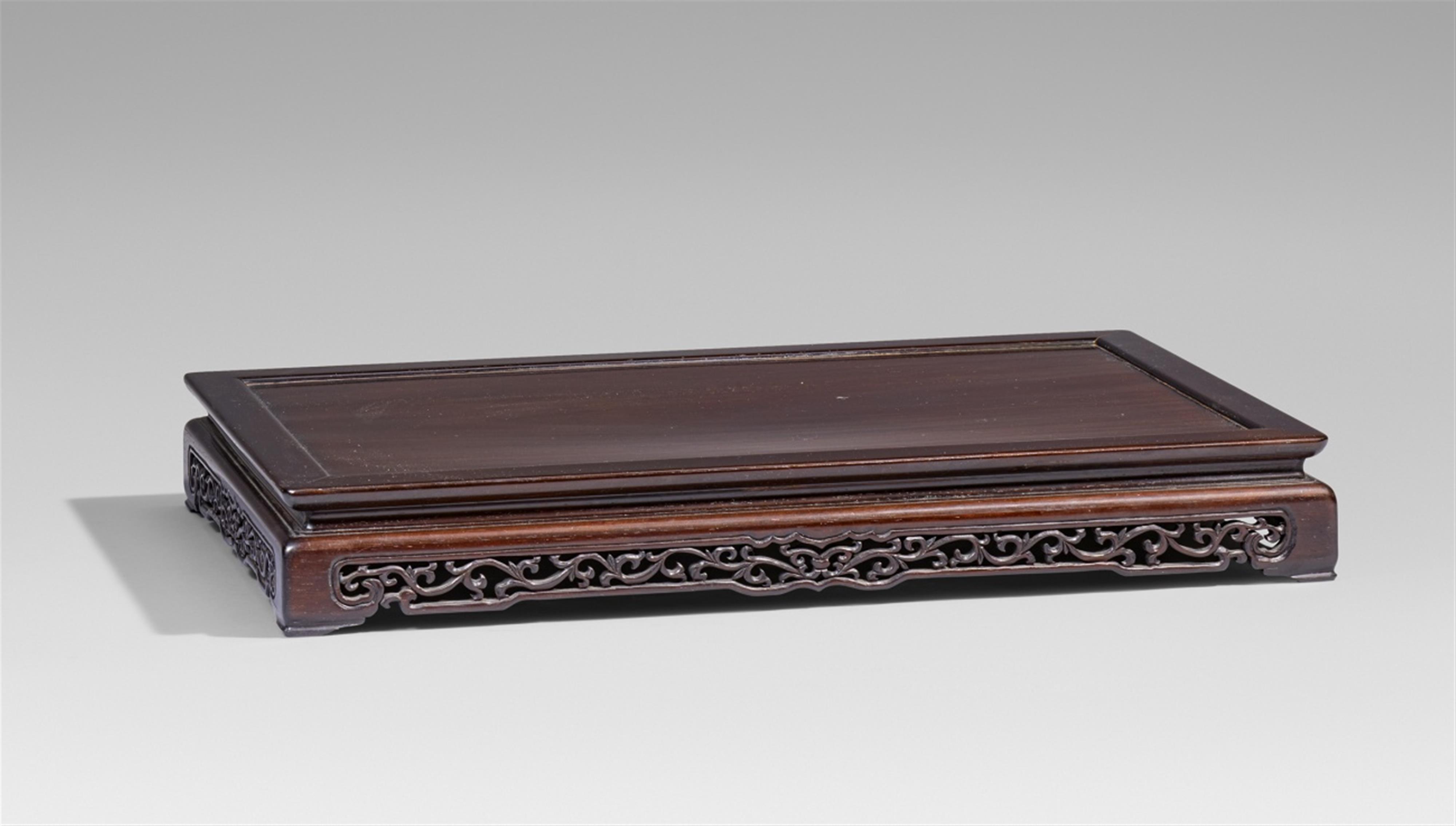 A large and very low wooden stand or table - image-1