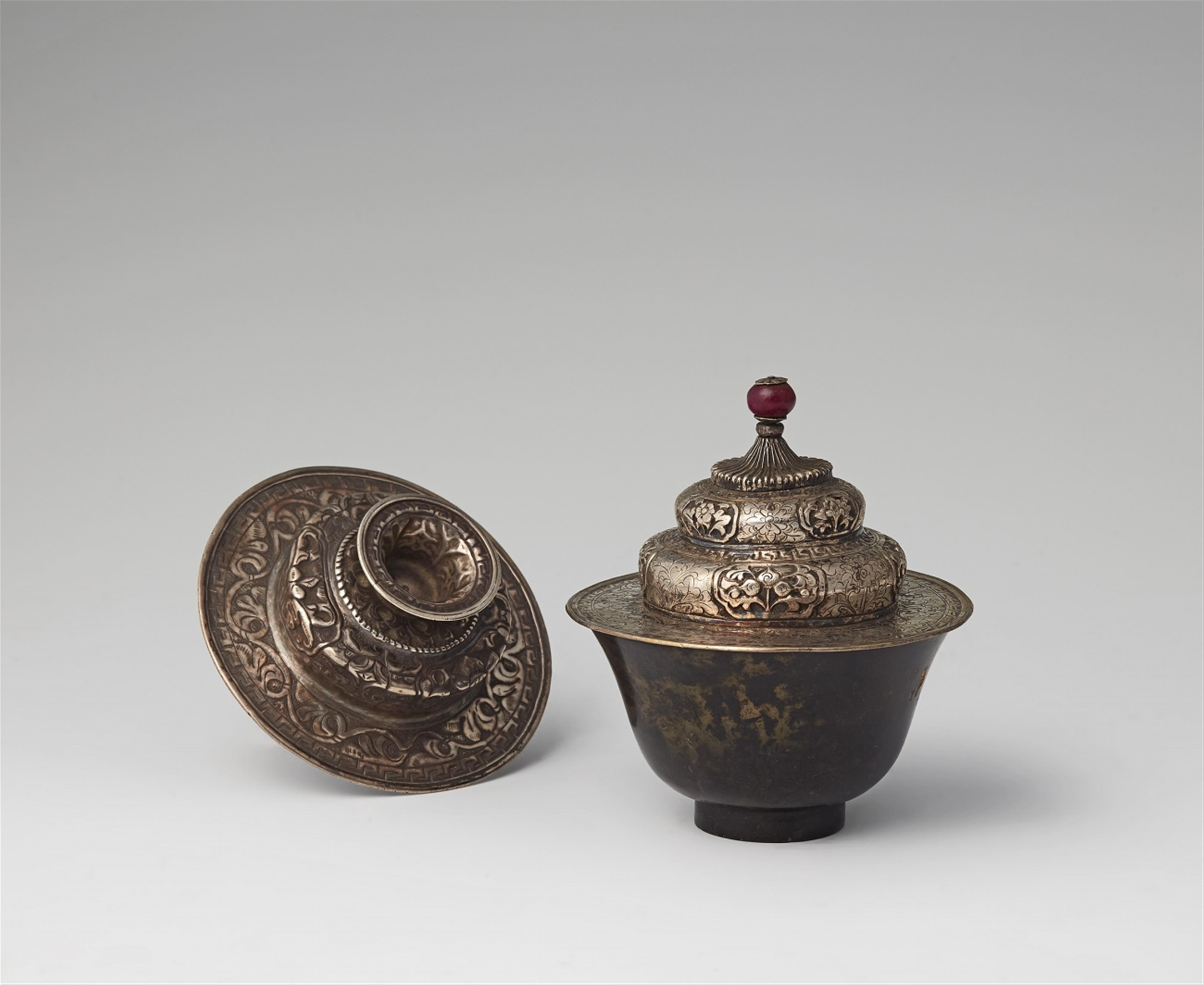 A Tibetan black-spotted jade tea cup with silver lid - image-1