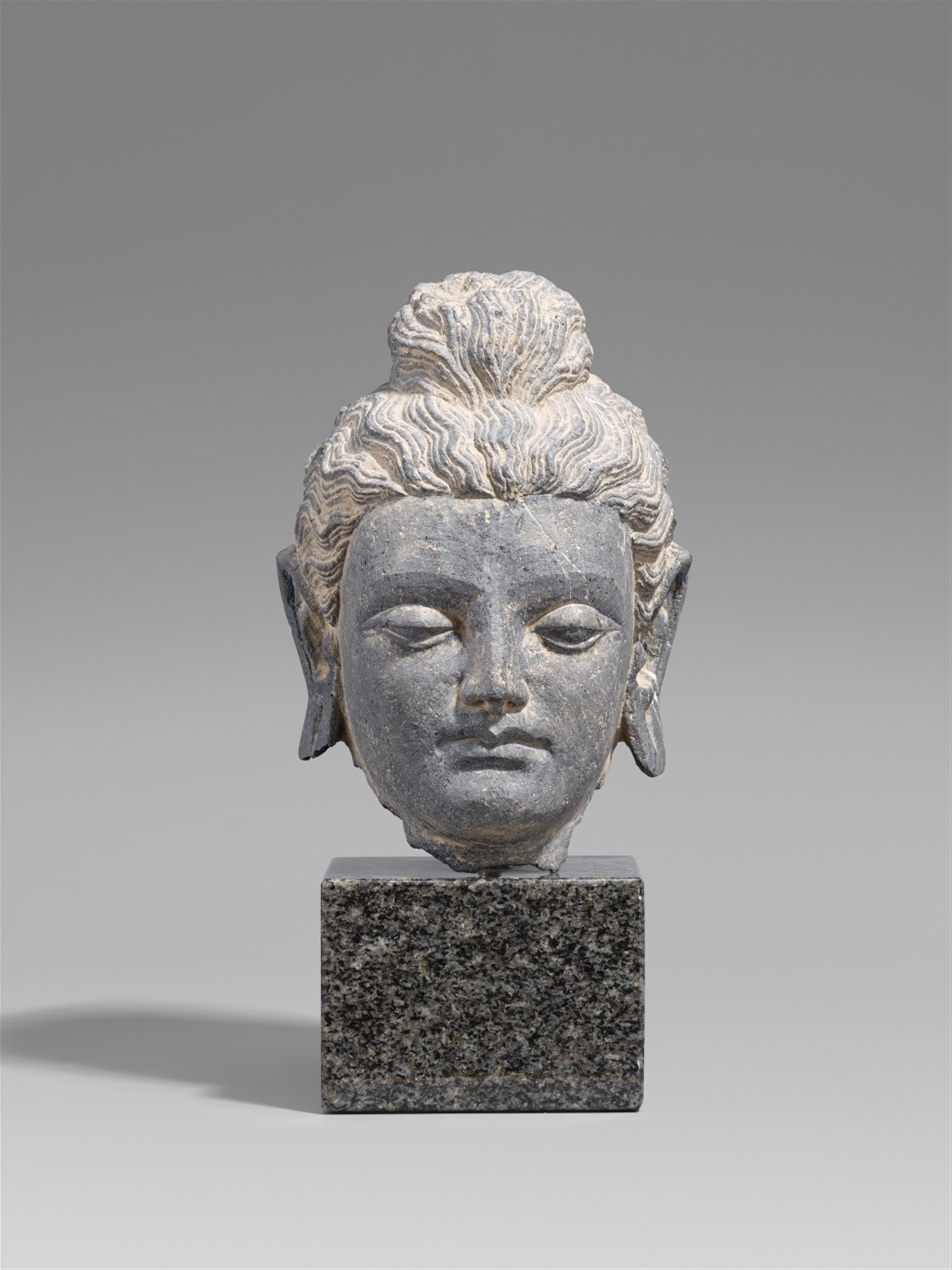 A Gandhara grey schist head of a Buddha. Pakistan. 2nd/3rd century - image-1