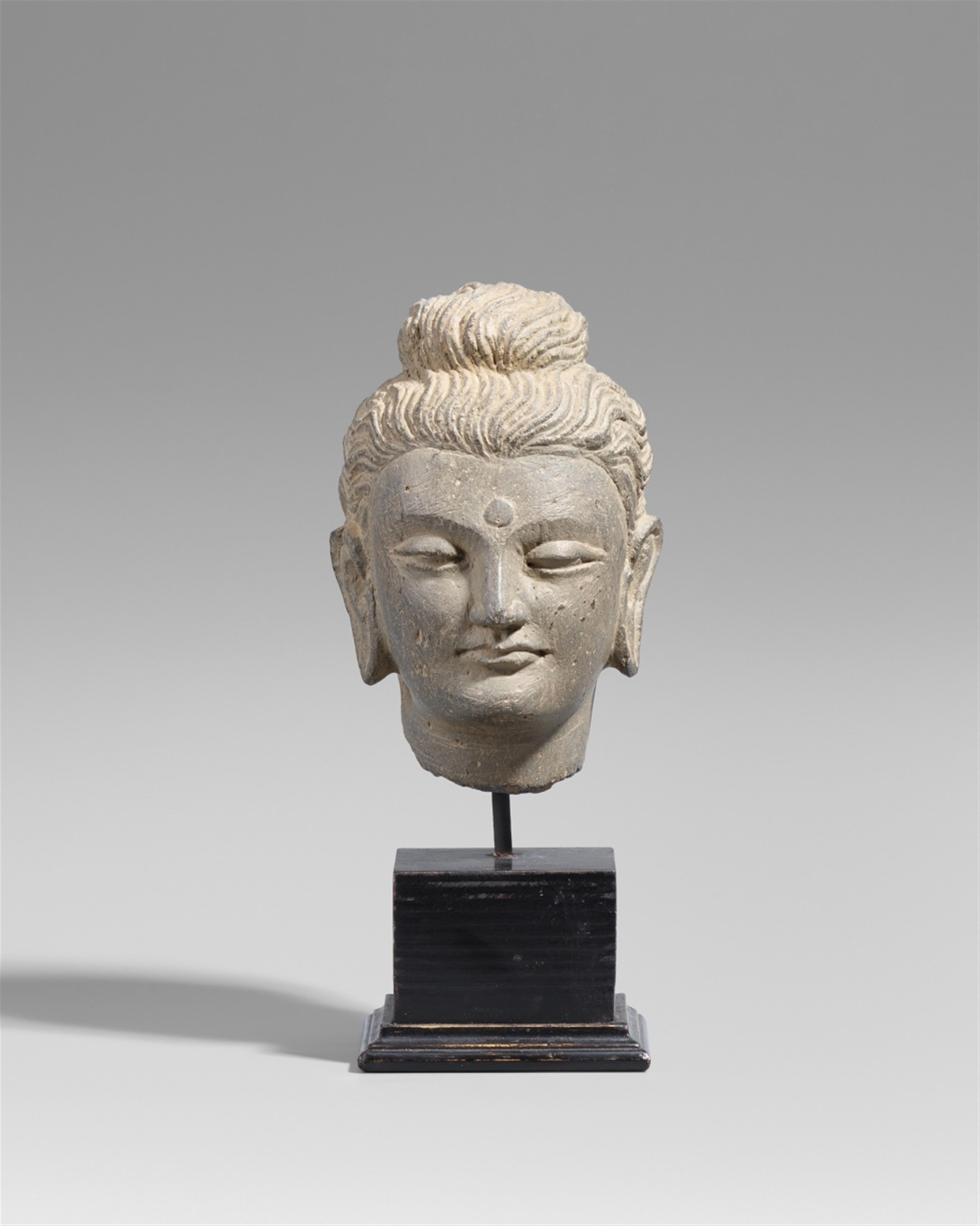 A small Gandhara grey schist head of a Buddha. Pakistan. 2nd/3rd century - image-1