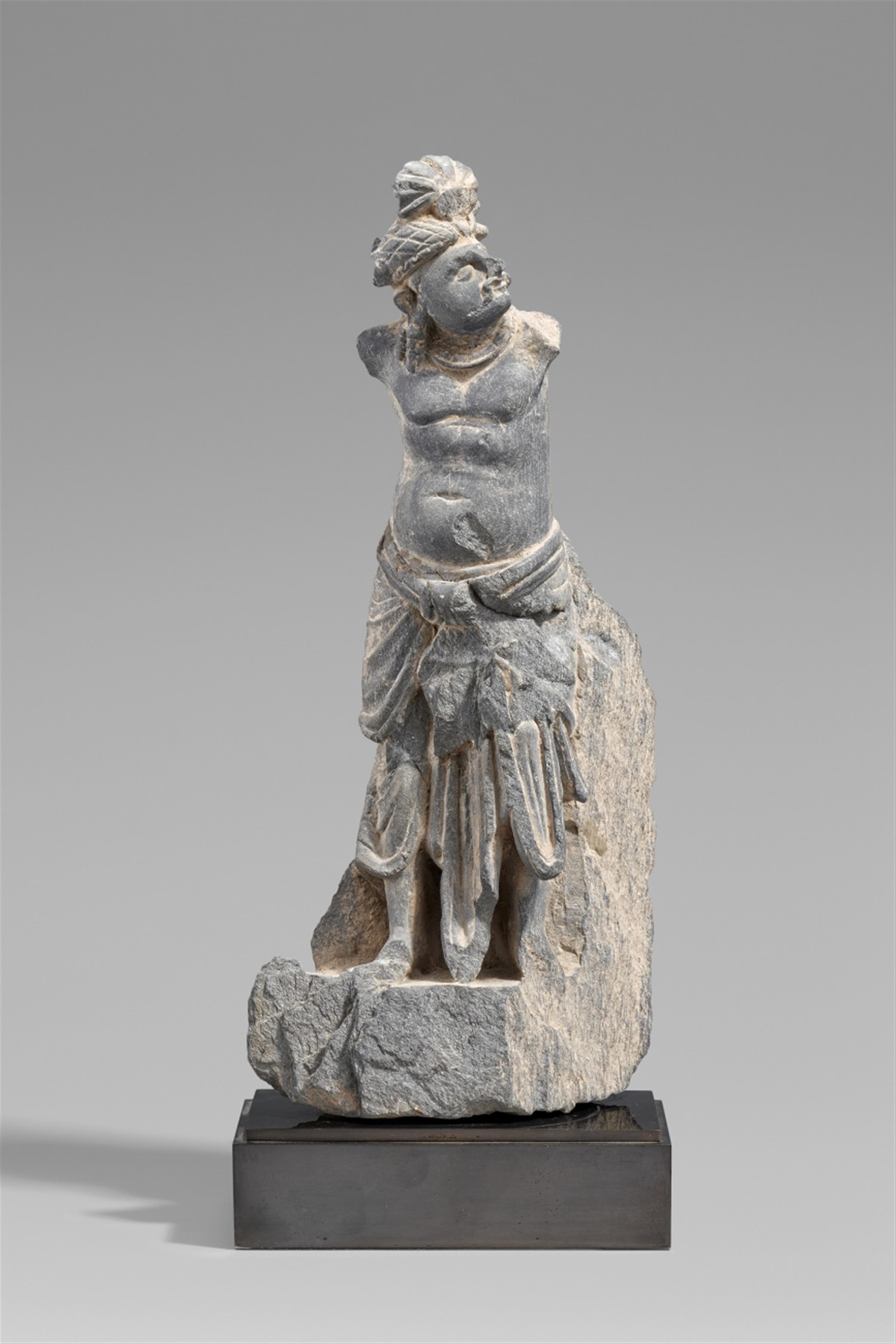 A Gandhara grey schist fragment of a standing man. Pakistan. 2nd/3rd century - image-1