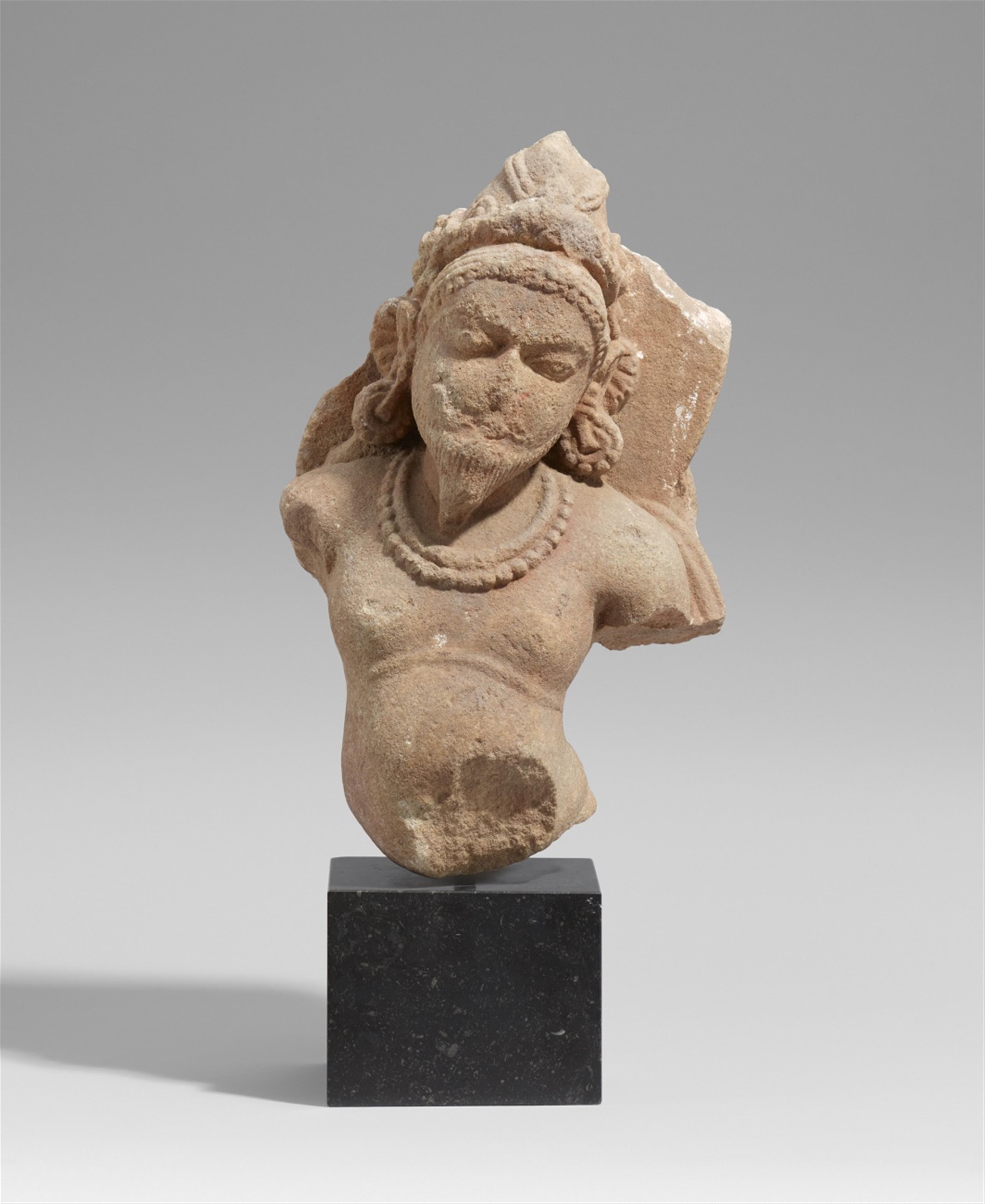 A Central Indian sandstone torso of the fire god Agni. 11th/12th century - image-1