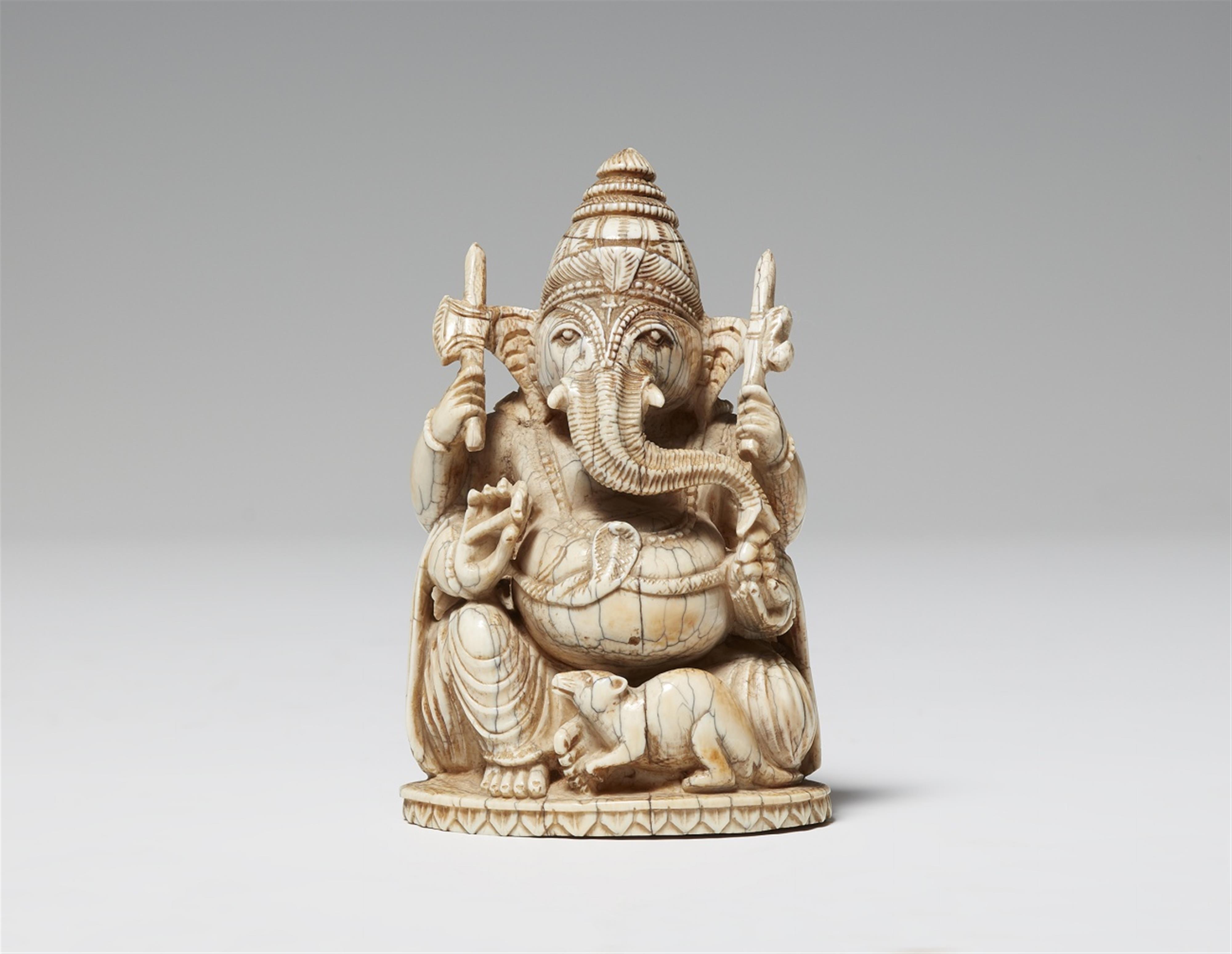 An ivory figure of a four-armed Ganesha. Around 1900 - image-1