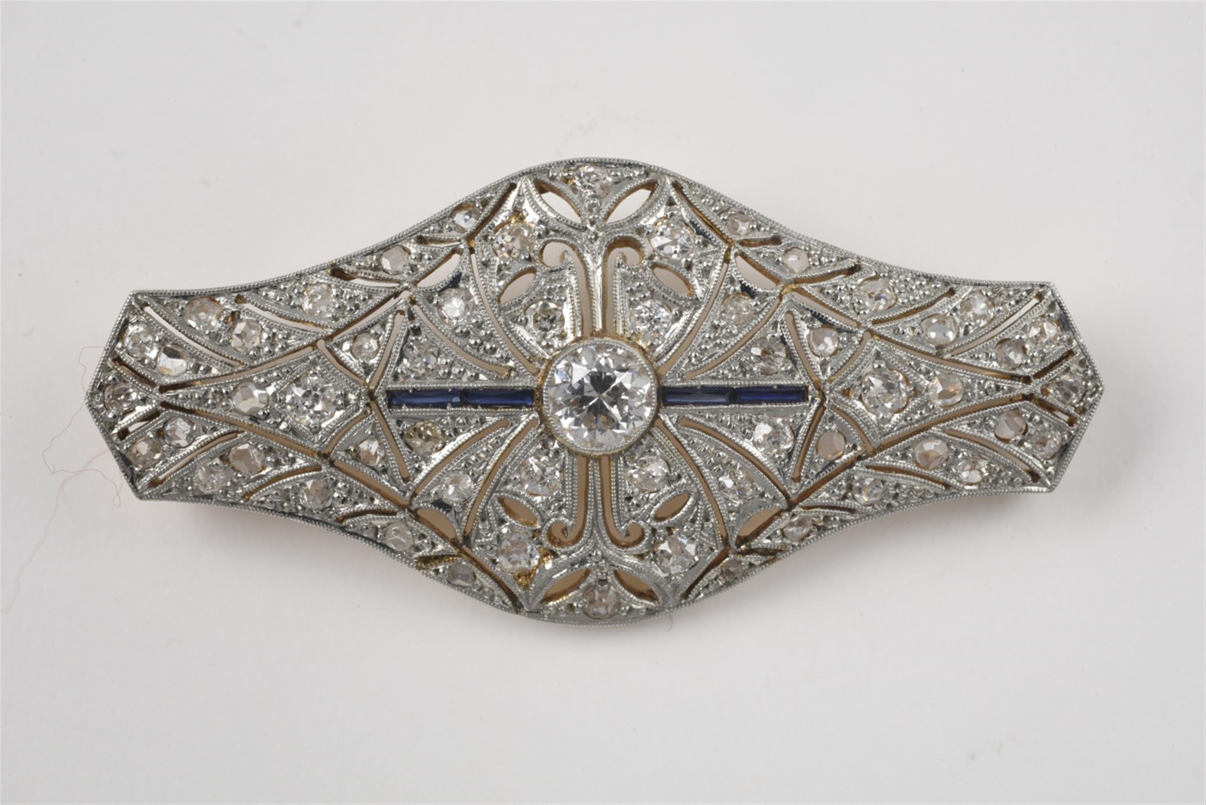 An Art Deco 14k gold and diamond brooch - image-1