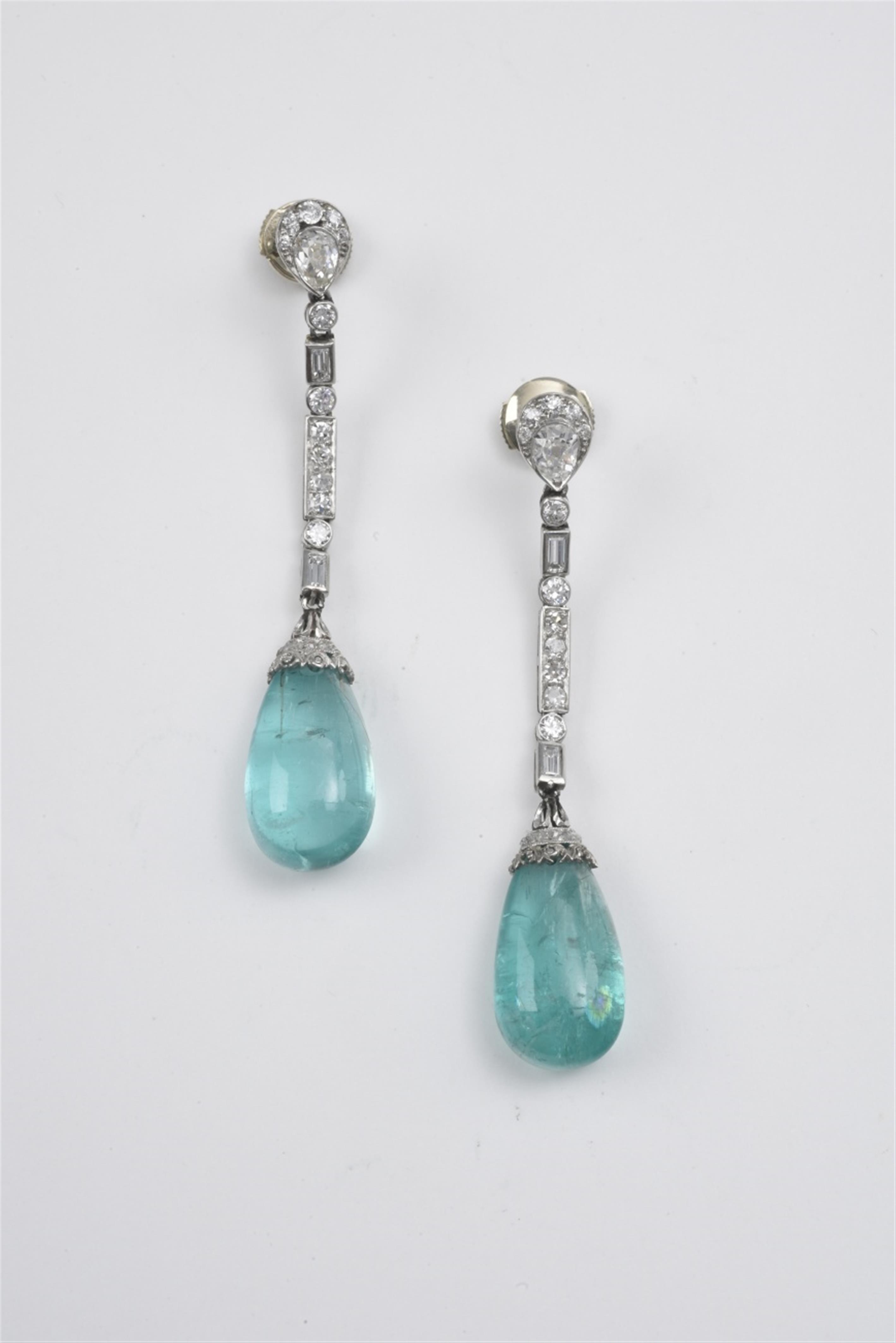 A pair of platinum and emerald earrings - image-1
