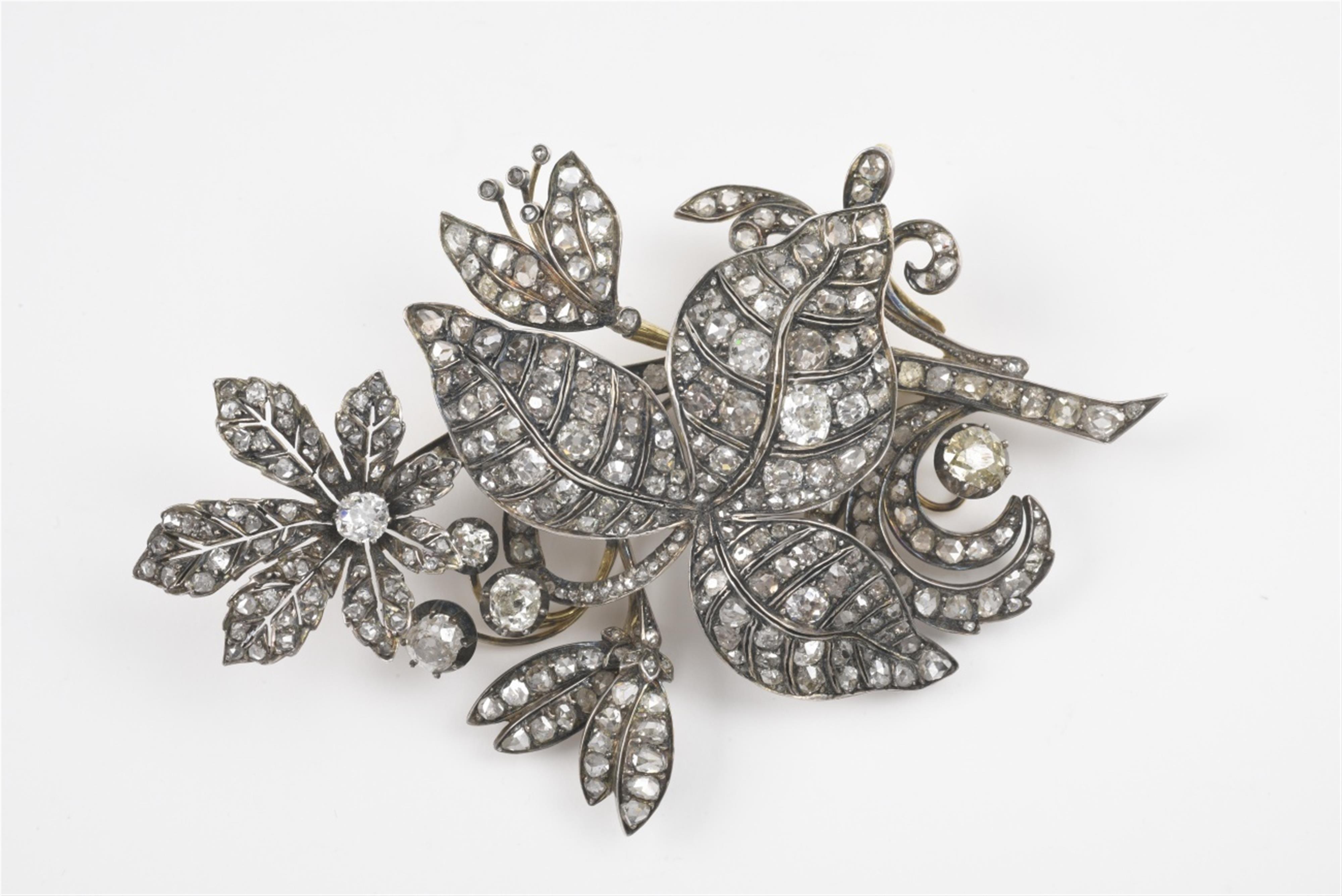 A 15k gold, silver and diamond flower brooch - image-1