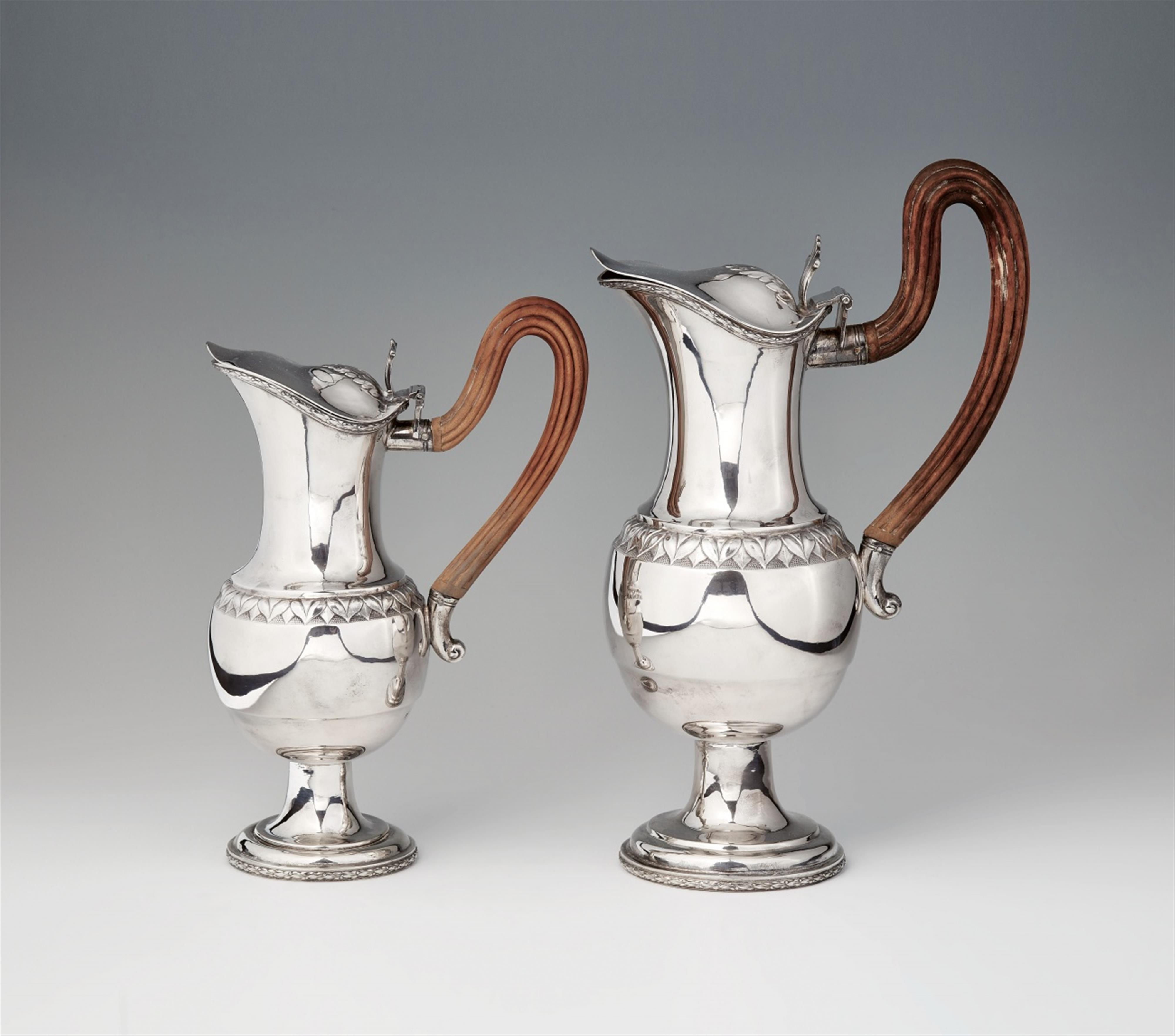 A pair of Augsburg silver wine pitchers - image-1