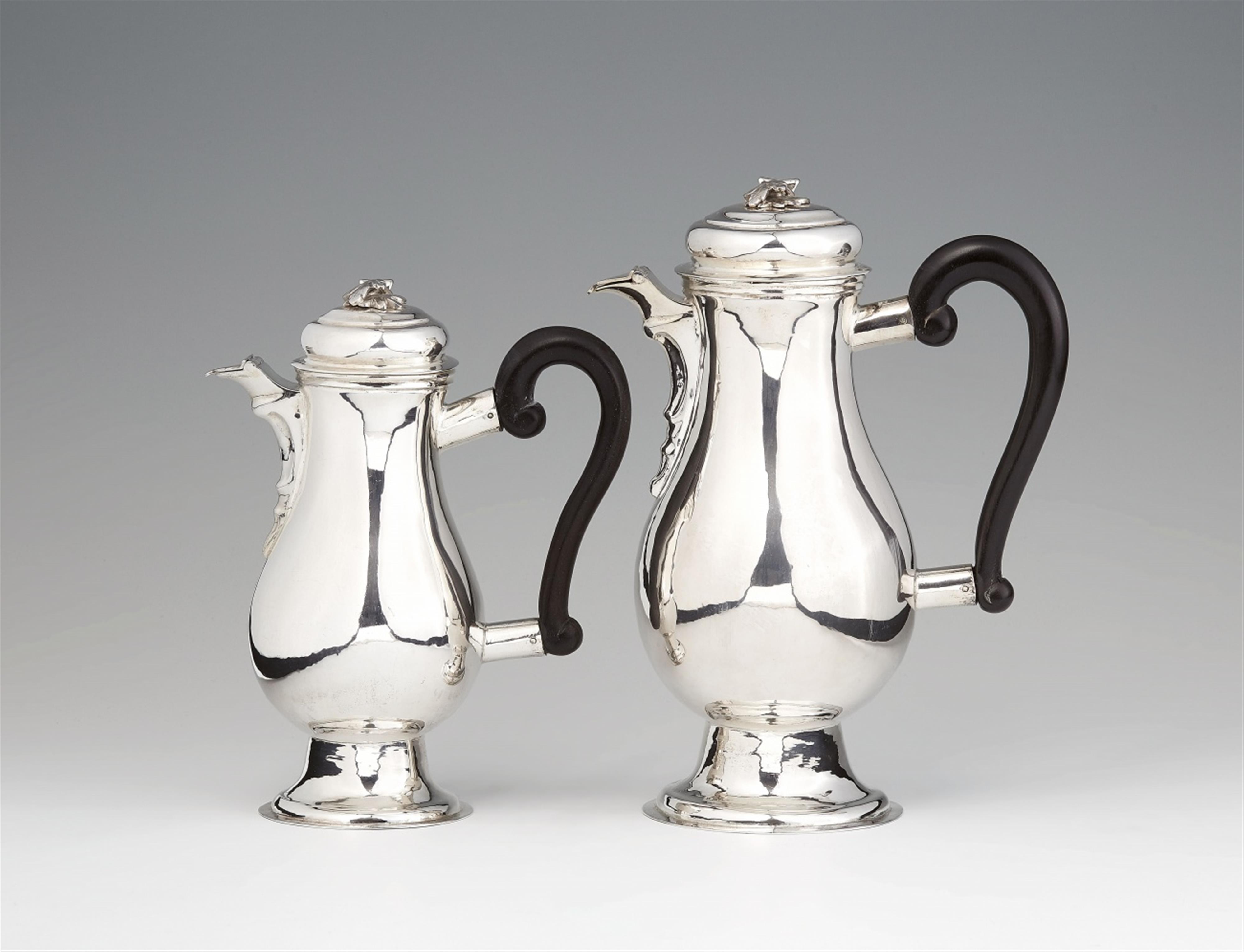 A pair of Augsburg silver pitchers - image-1