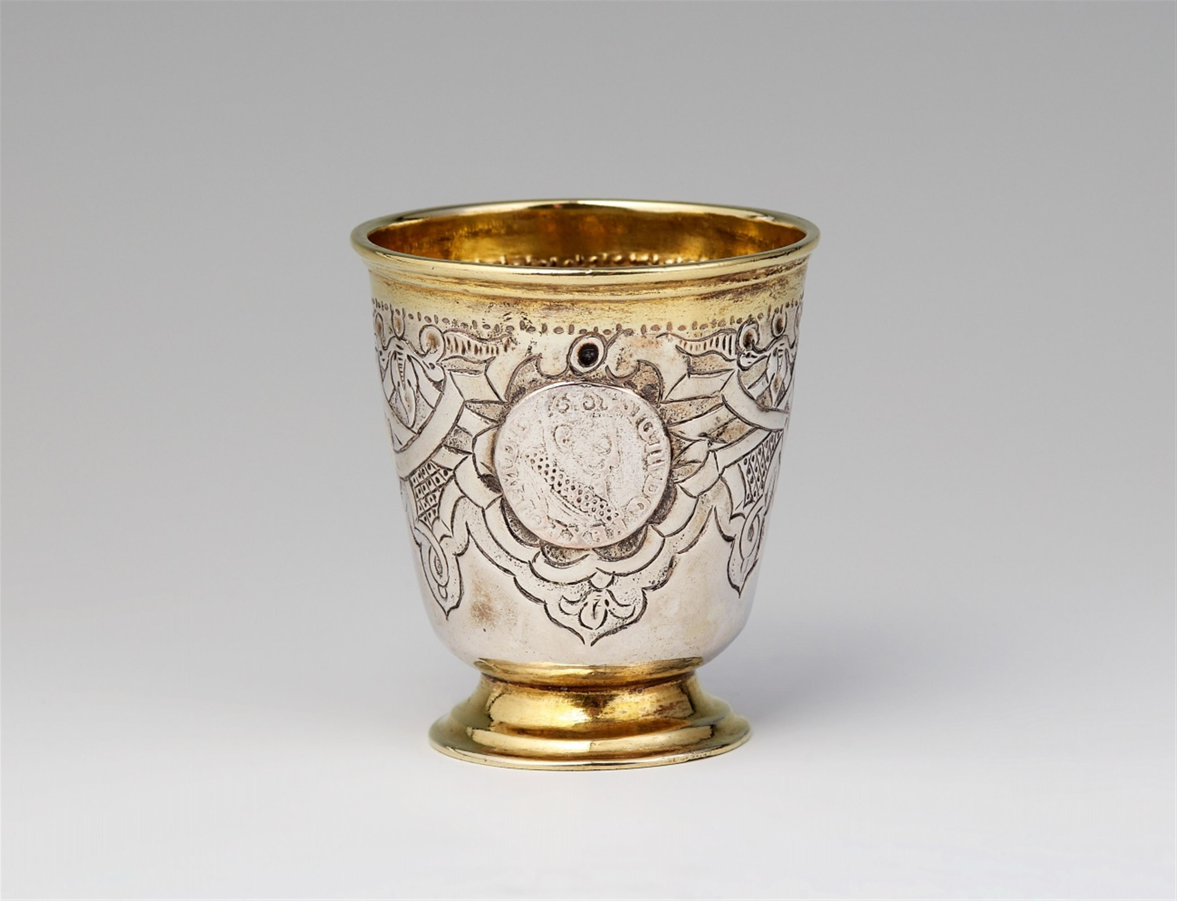 A small parcel gilt silver coin-set beaker - image-1