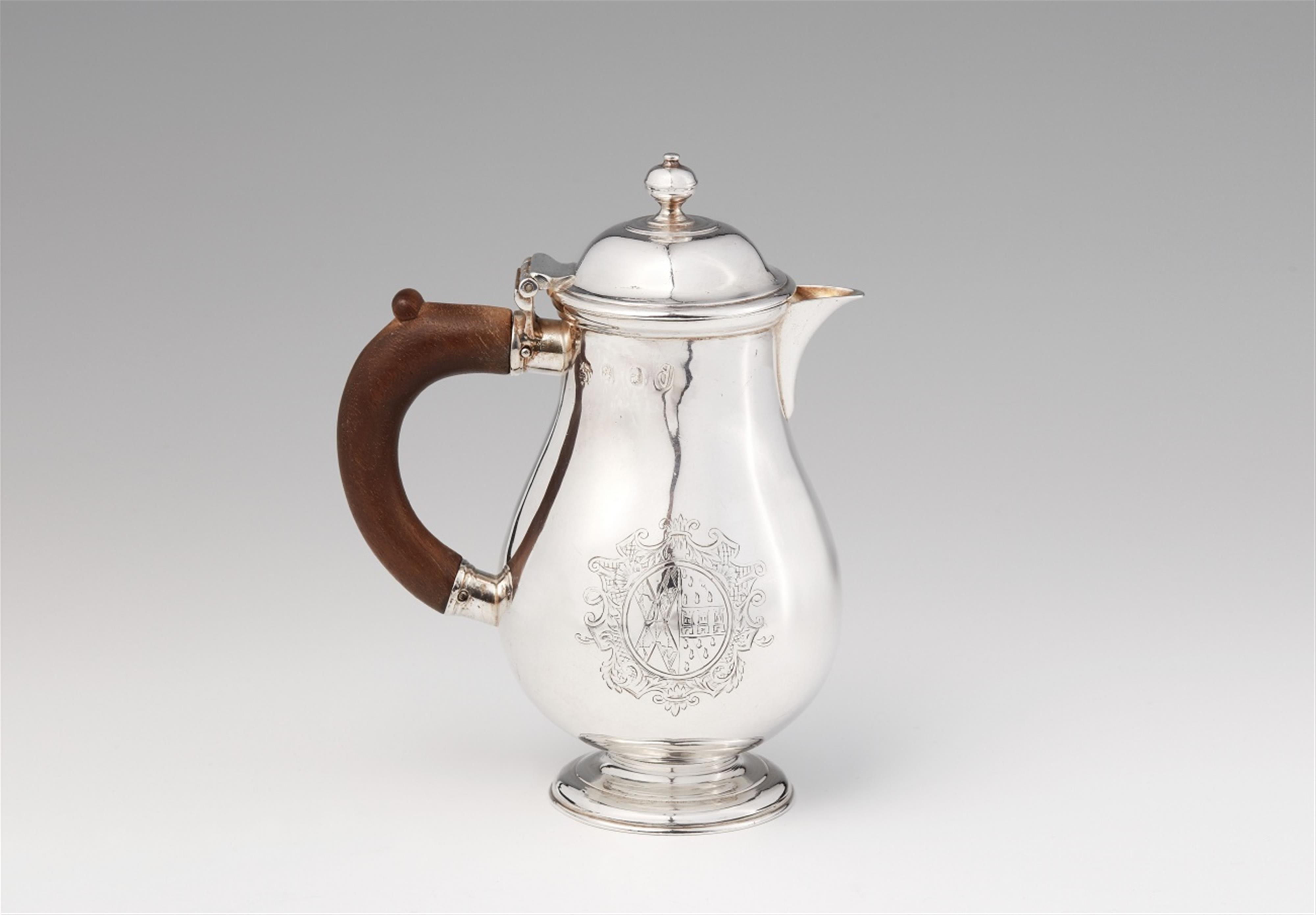 A Queen Anne silver hot milk jug - image-1