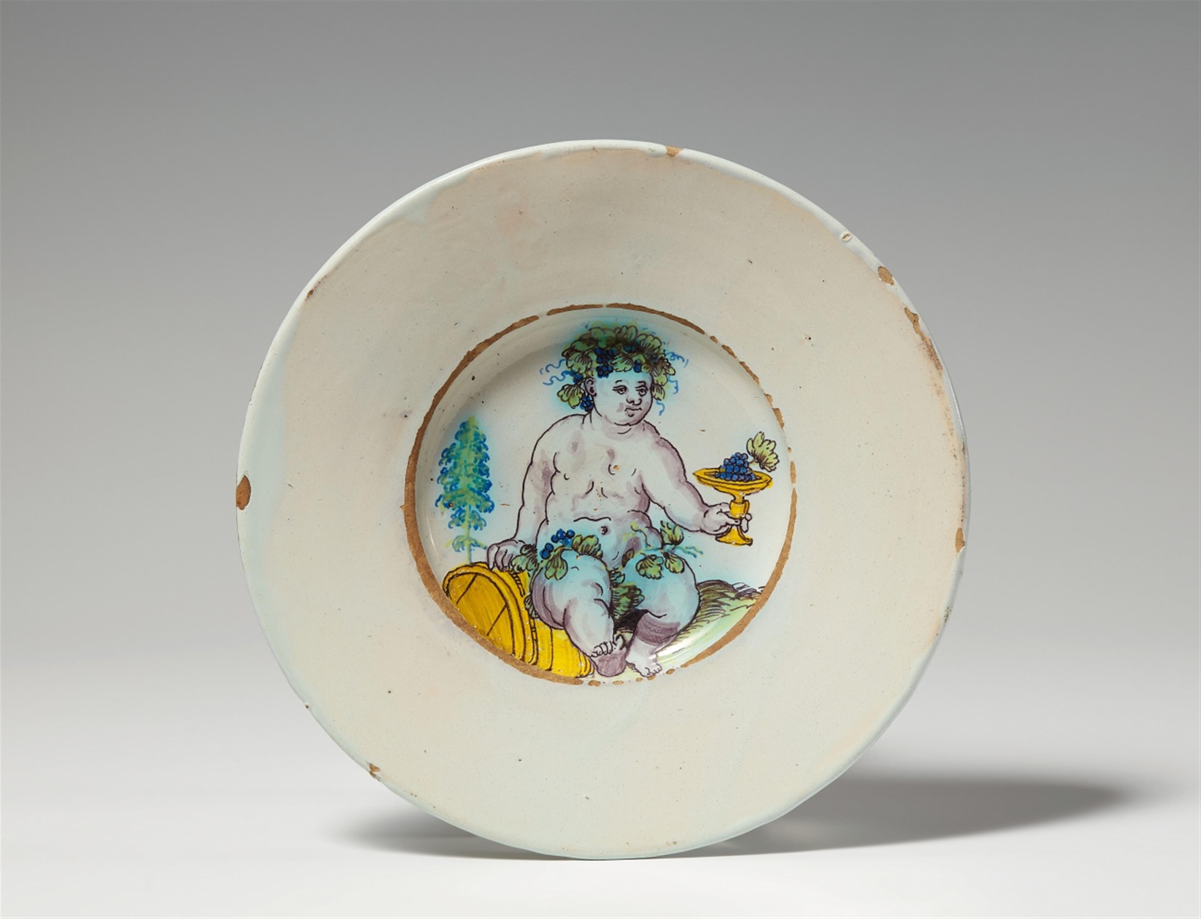 A Winterthur faience plate with a putto as an allegory of Autumn - image-1