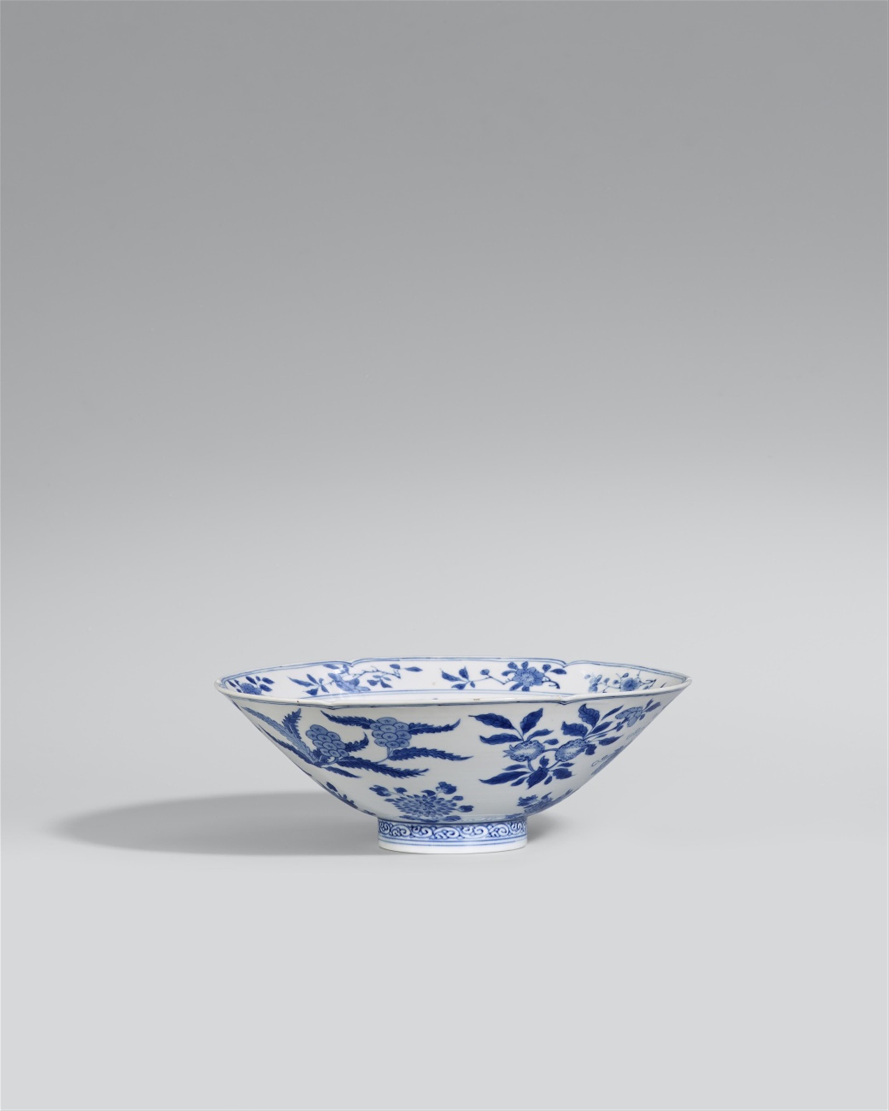 A blue and white ‘fruit and flower’ bowl. Kangxi period (1662-1722) - image-1