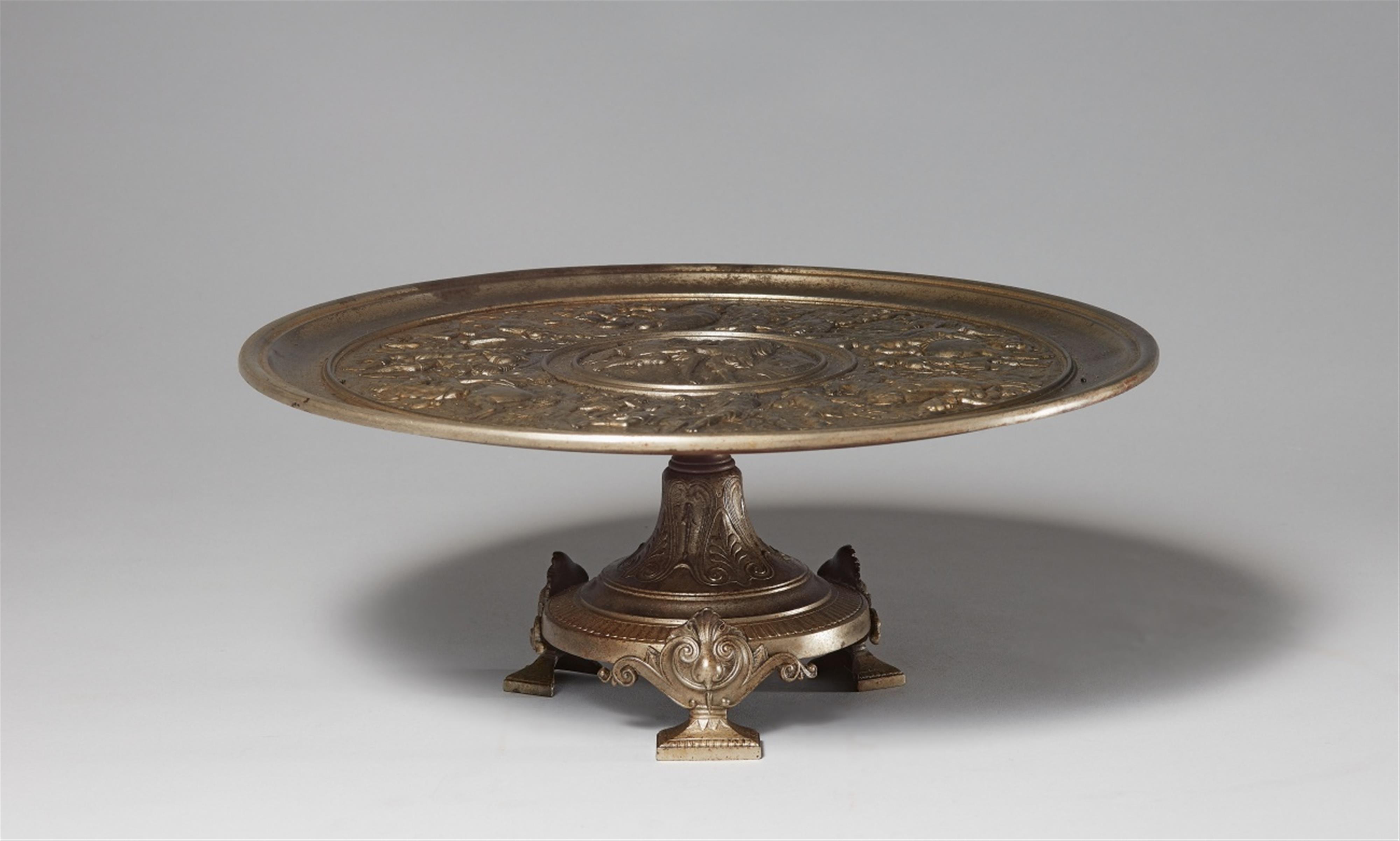 A cast iron tazza with a battle scene - image-1